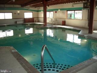 0 Edward Taylor Road, Unit 6 Ocean City, MD 21842 - Photo 4 of 6 a view of a swimming pool with a yard