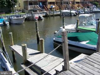 0 Edward Taylor Road, Unit 6 Ocean City, MD 21842 - Photo 5 of 6 a view of a lake with couches chairs