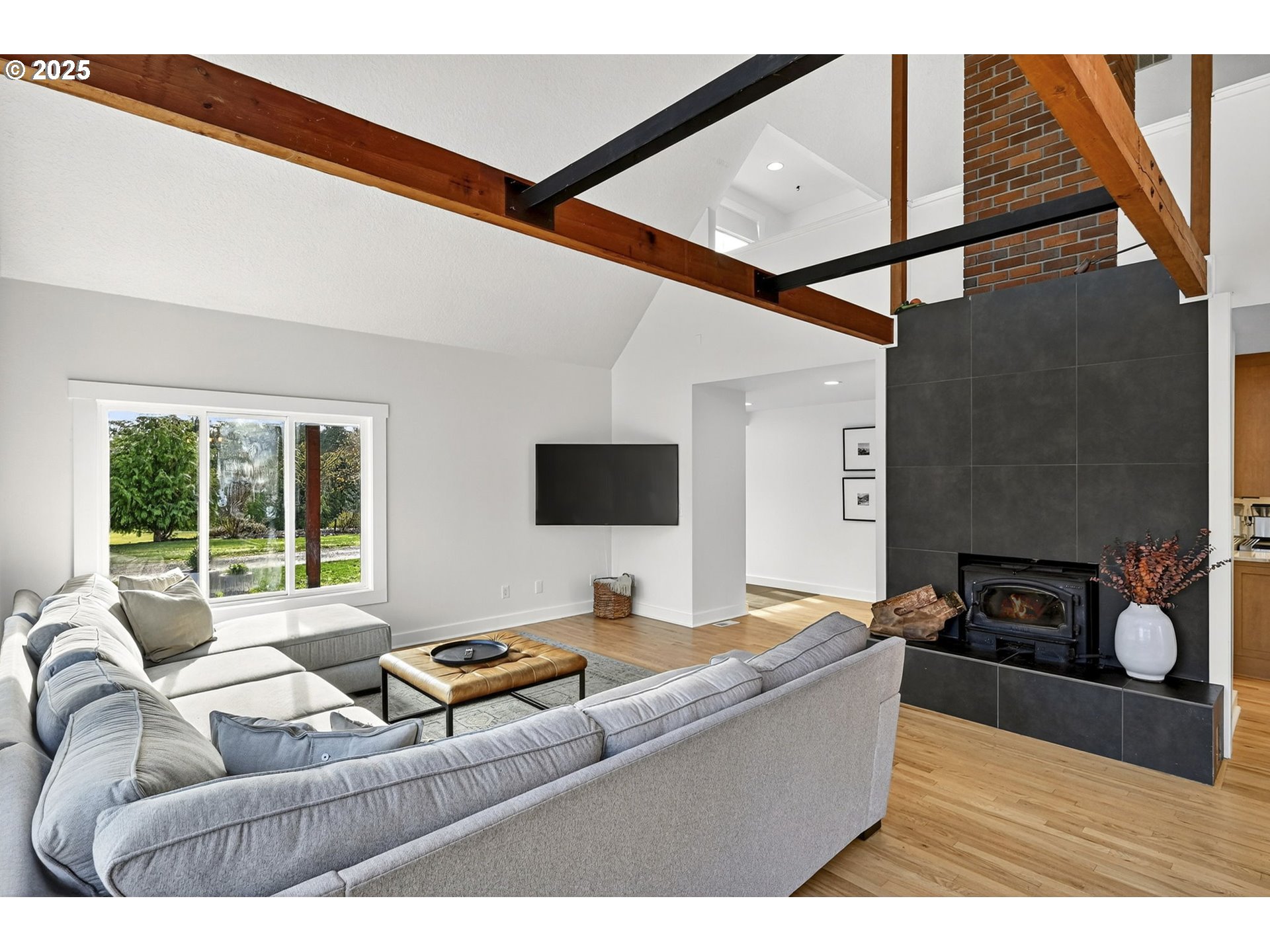 13162 Northwest McNamee Road Portland, OR 97231 - Photo 11 of 48 a living room with furniture and a fireplace