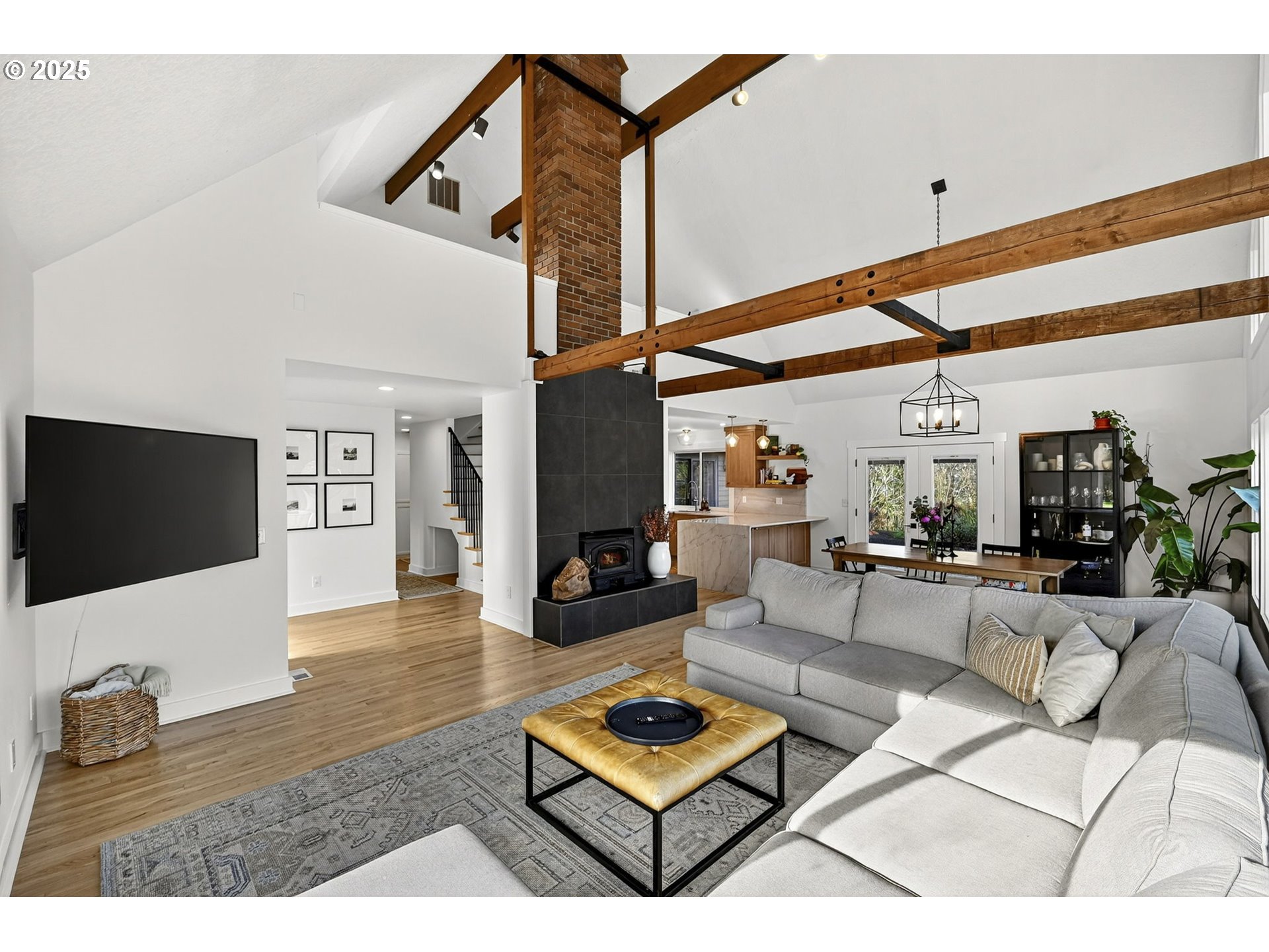 13162 Northwest McNamee Road Portland, OR 97231 - Photo 13 of 48 a living room with furniture and a flat screen tv