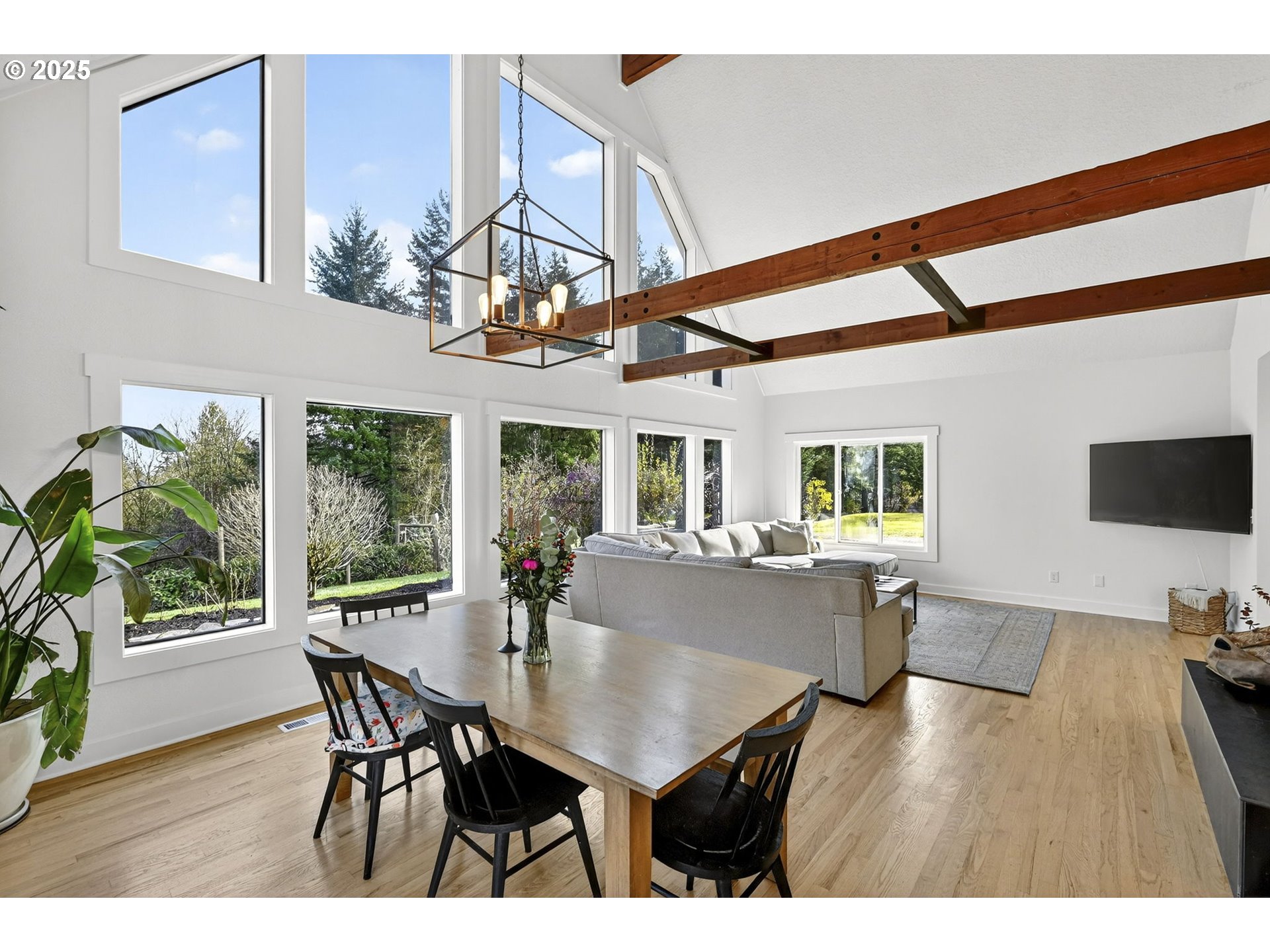 13162 Northwest McNamee Road Portland, OR 97231 - Photo 15 of 48 a view of a dining room with furniture window and wooden floor