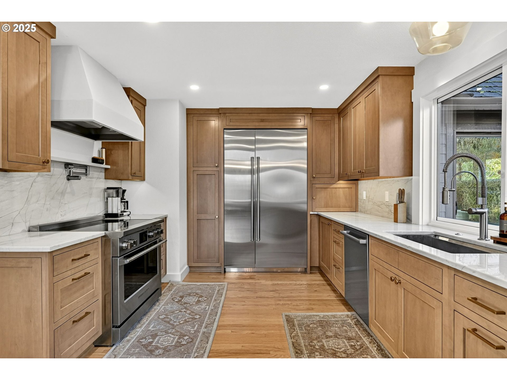 13162 Northwest McNamee Road Portland, OR 97231 - Photo 19 of 48 a kitchen with a sink stainless steel appliances and cabinets