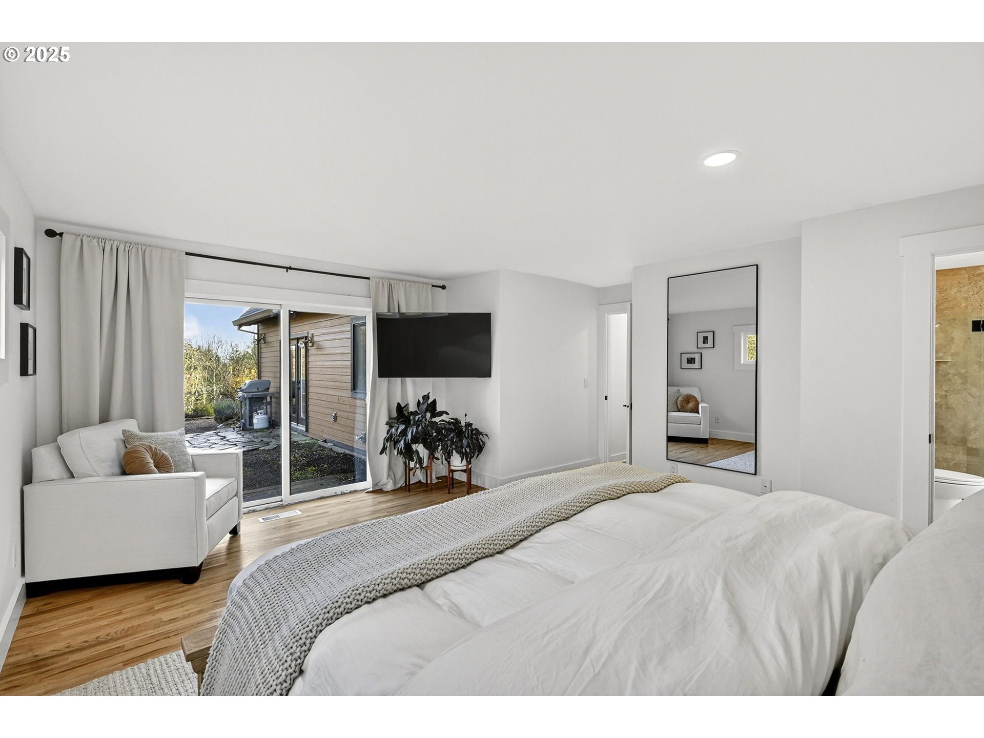 13162 Northwest McNamee Road Portland, OR 97231 - Photo 23 of 48 a bedroom with a bed and a couch