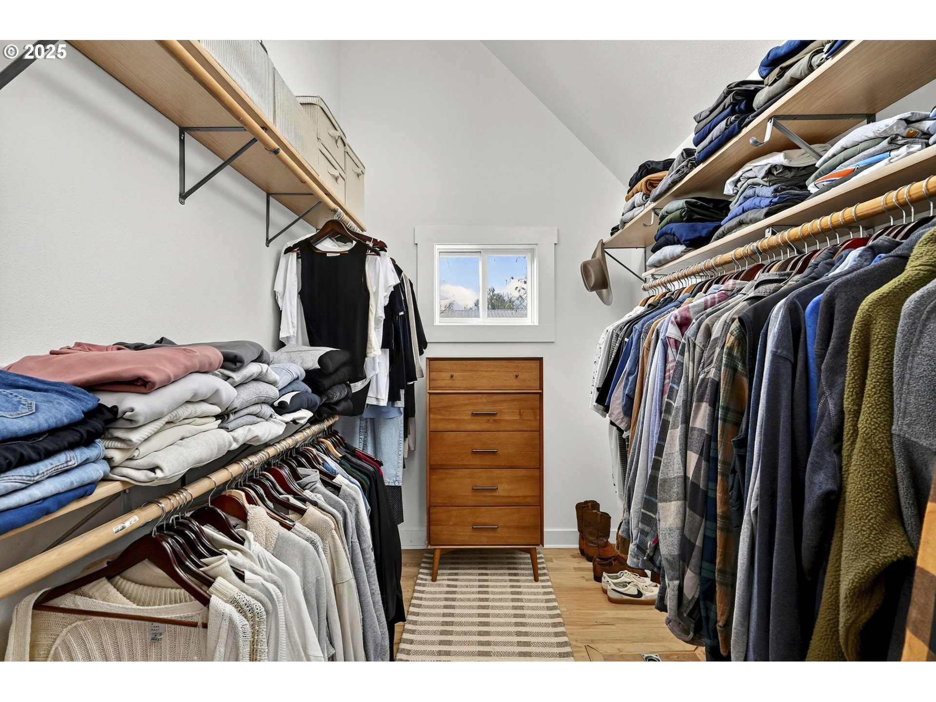 13162 Northwest McNamee Road Portland, OR 97231 - Photo 26 of 48 a view of walk in closet with clothes and shoes