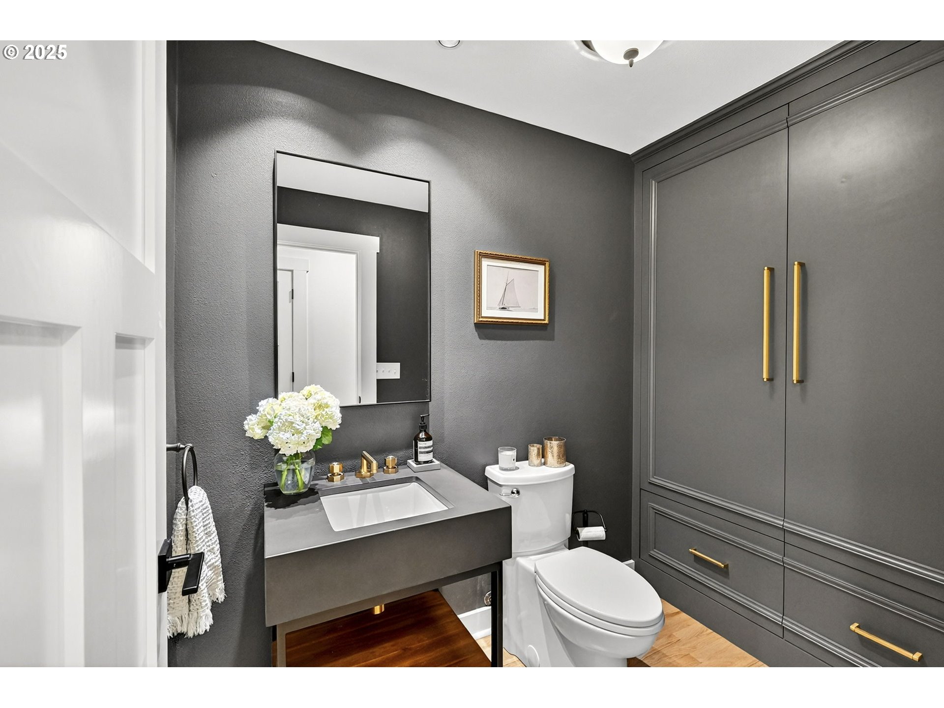 13162 Northwest McNamee Road Portland, OR 97231 - Photo 29 of 48 a bathroom with a sink a toilet and mirror