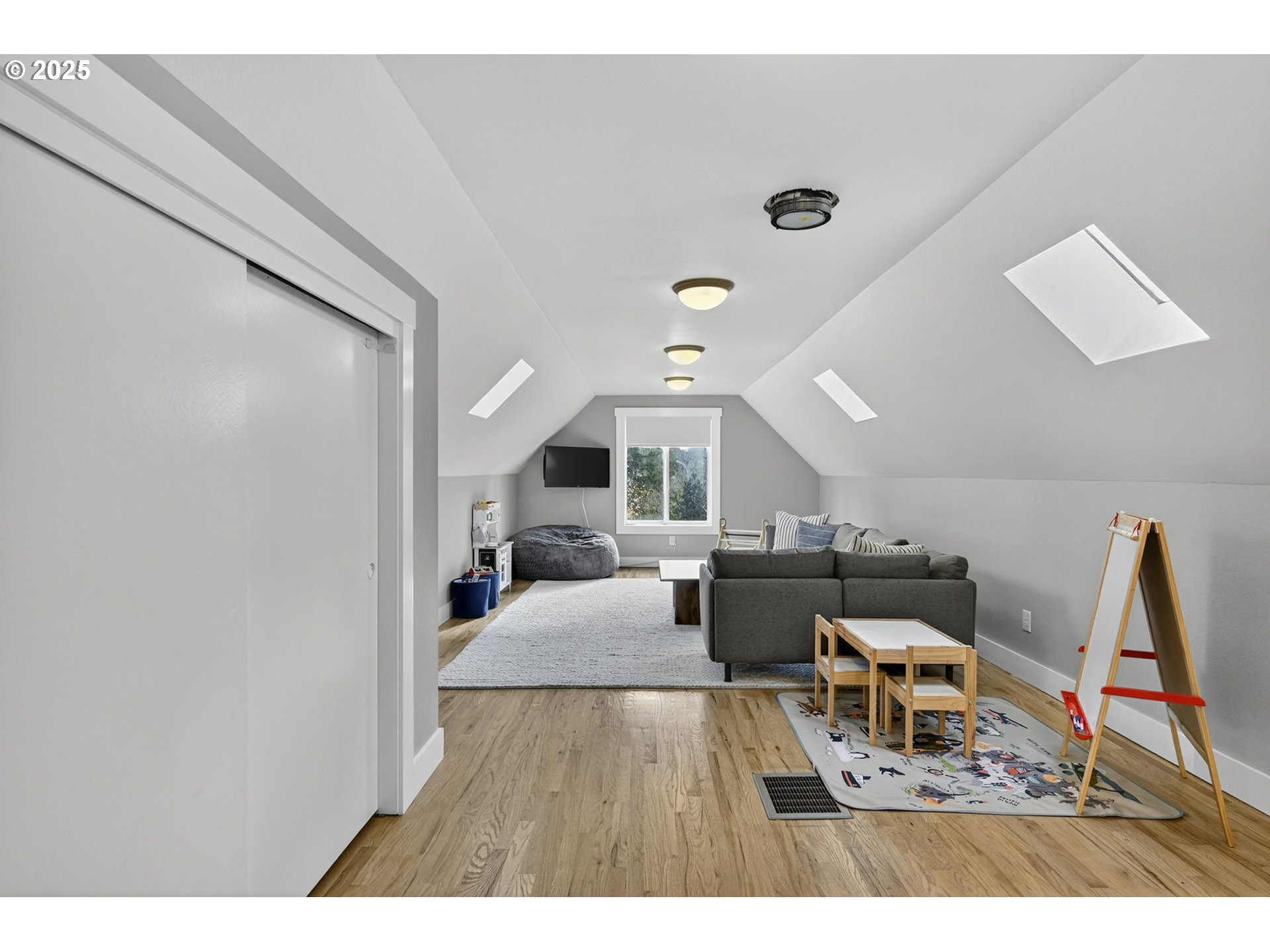 13162 Northwest McNamee Road Portland, OR 97231 - Photo 36 of 48 a living room with furniture and a wooden floor
