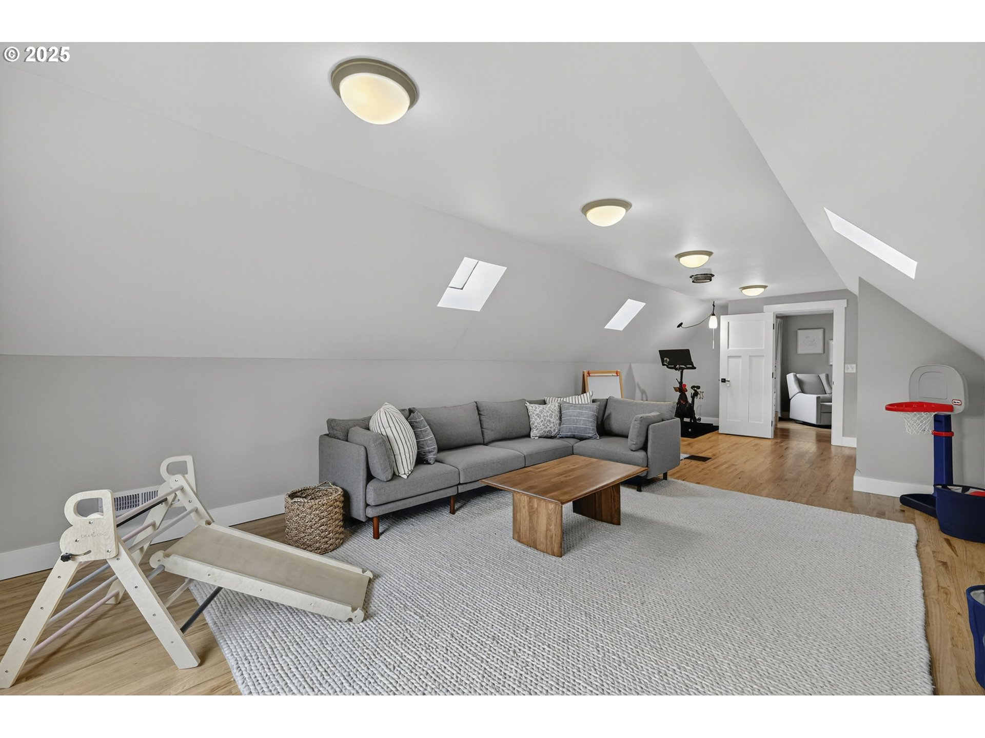 13162 Northwest McNamee Road Portland, OR 97231 - Photo 38 of 48 a living room with furniture and a wall painting