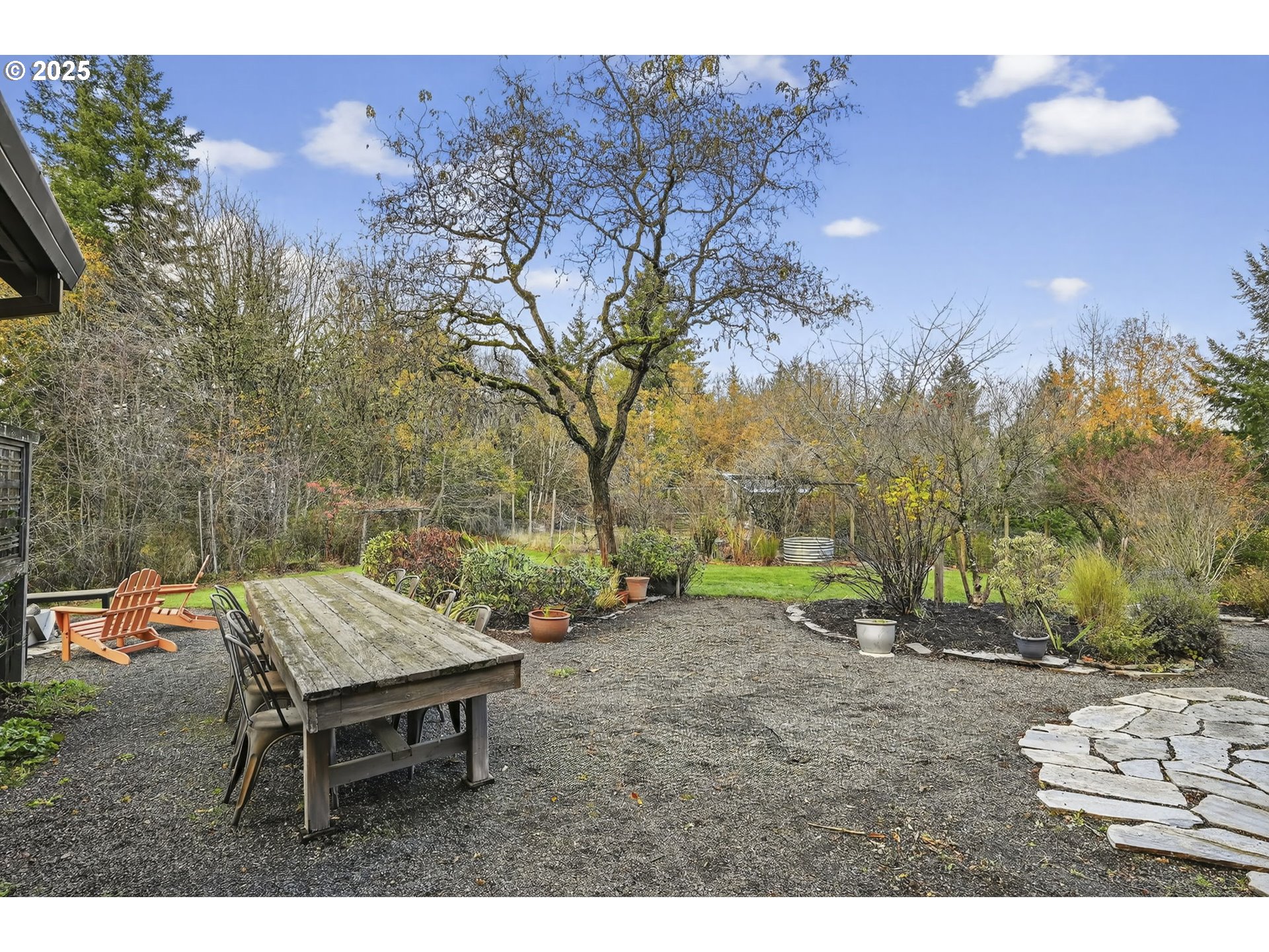 13162 Northwest McNamee Road Portland, OR 97231 - Photo 42 of 48 a backyard of a house with table and chairs