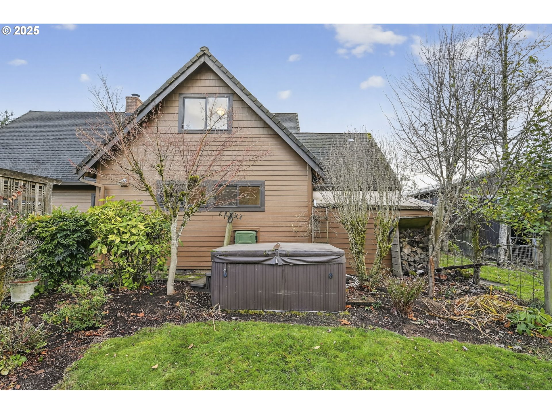 13162 Northwest McNamee Road Portland, OR 97231 - Photo 43 of 48 a front view of house with backyard and green space