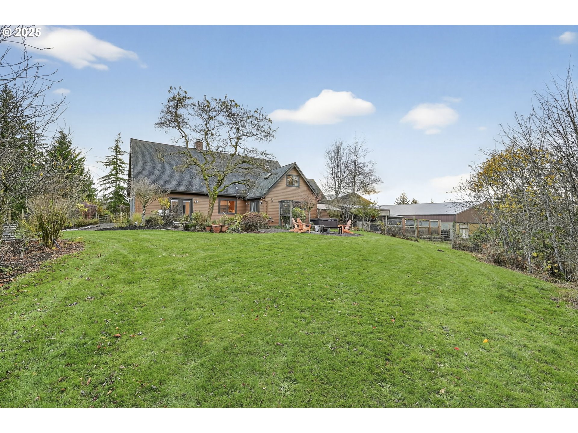 13162 Northwest McNamee Road Portland, OR 97231 - Photo 44 of 48 a view of a house with a back yard