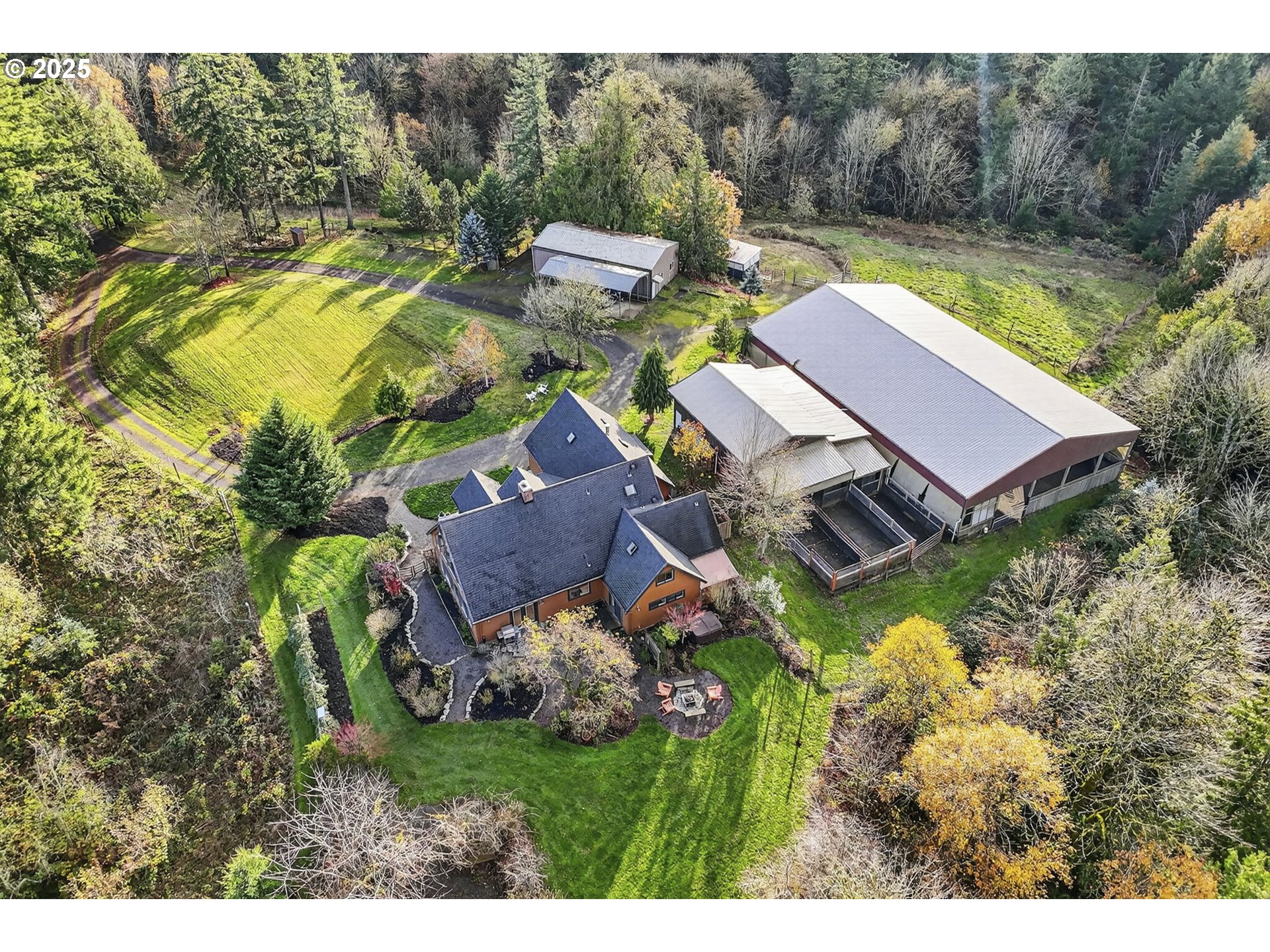 13162 Northwest McNamee Road Portland, OR 97231 - Photo 46 of 48 a view of a swimming pool with lawn chairs and a fire pit