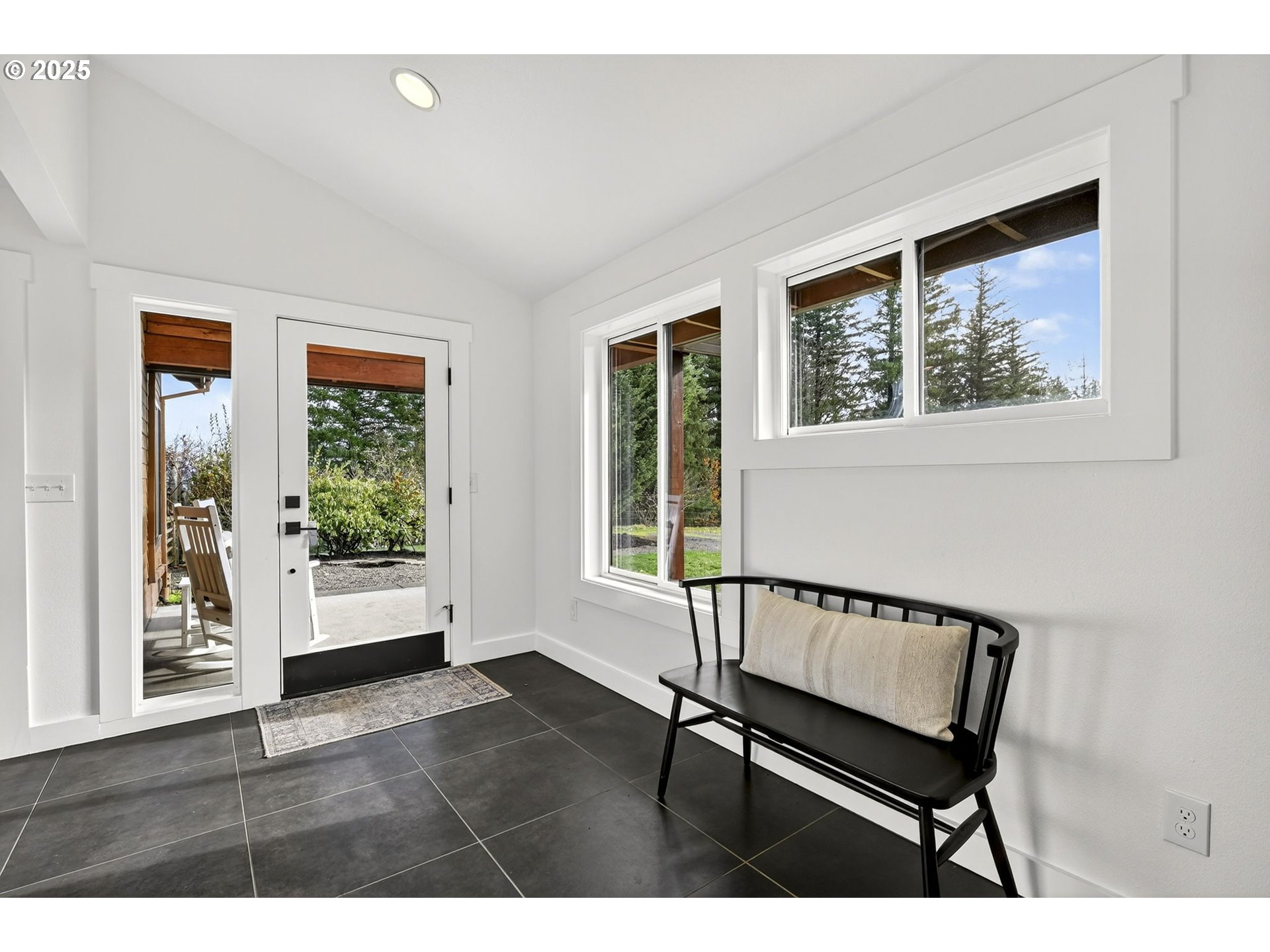13162 Northwest McNamee Road Portland, OR 97231 - Photo 8 of 48 a view of a hallway with wooden floor and a window
