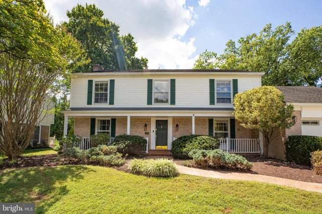 a front view of a house with a yard garage and outdoor seating
