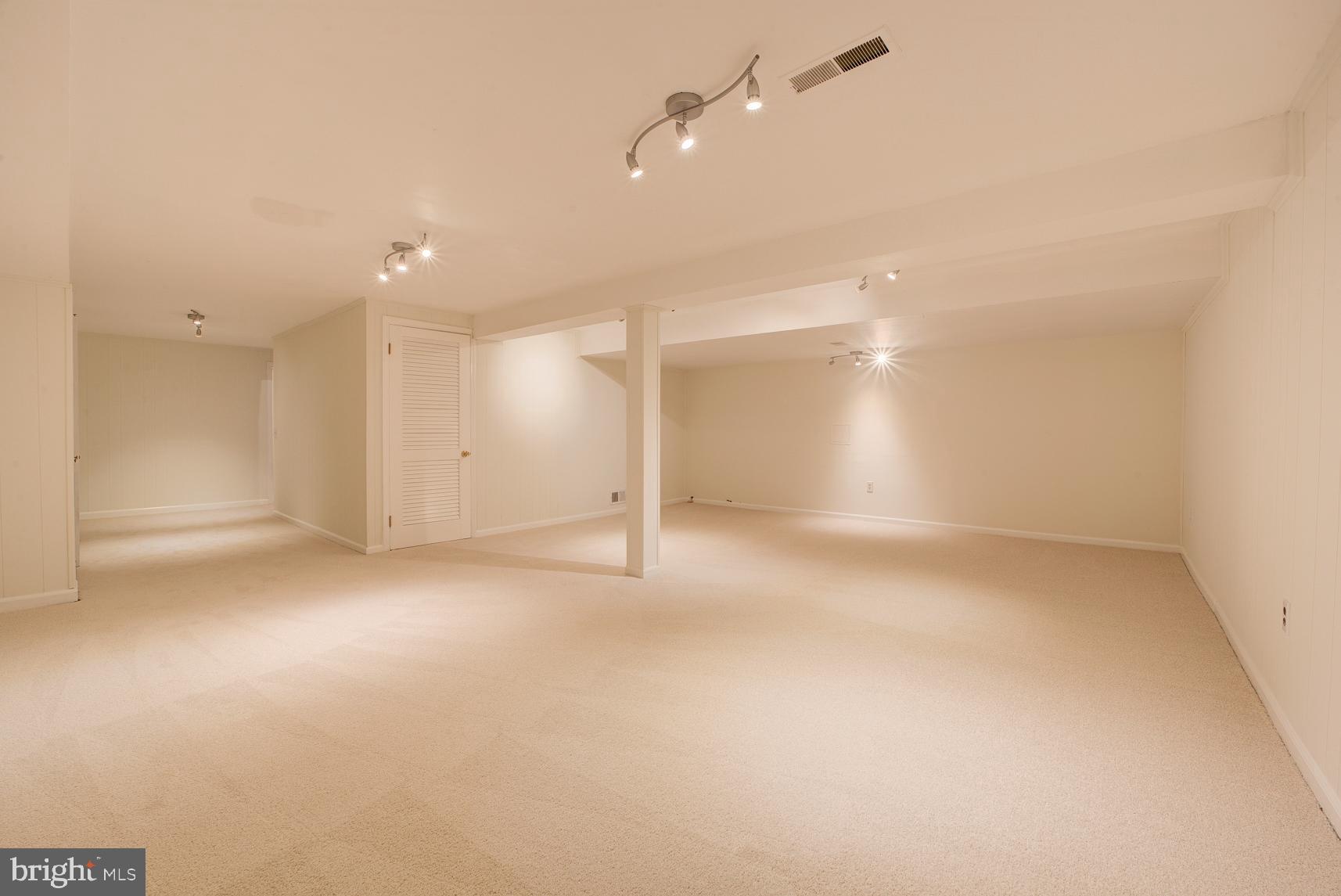 9116 Wooden Bridge Road Potomac, MD 20854 - Photo 21 of 22 an empty room with an empty space