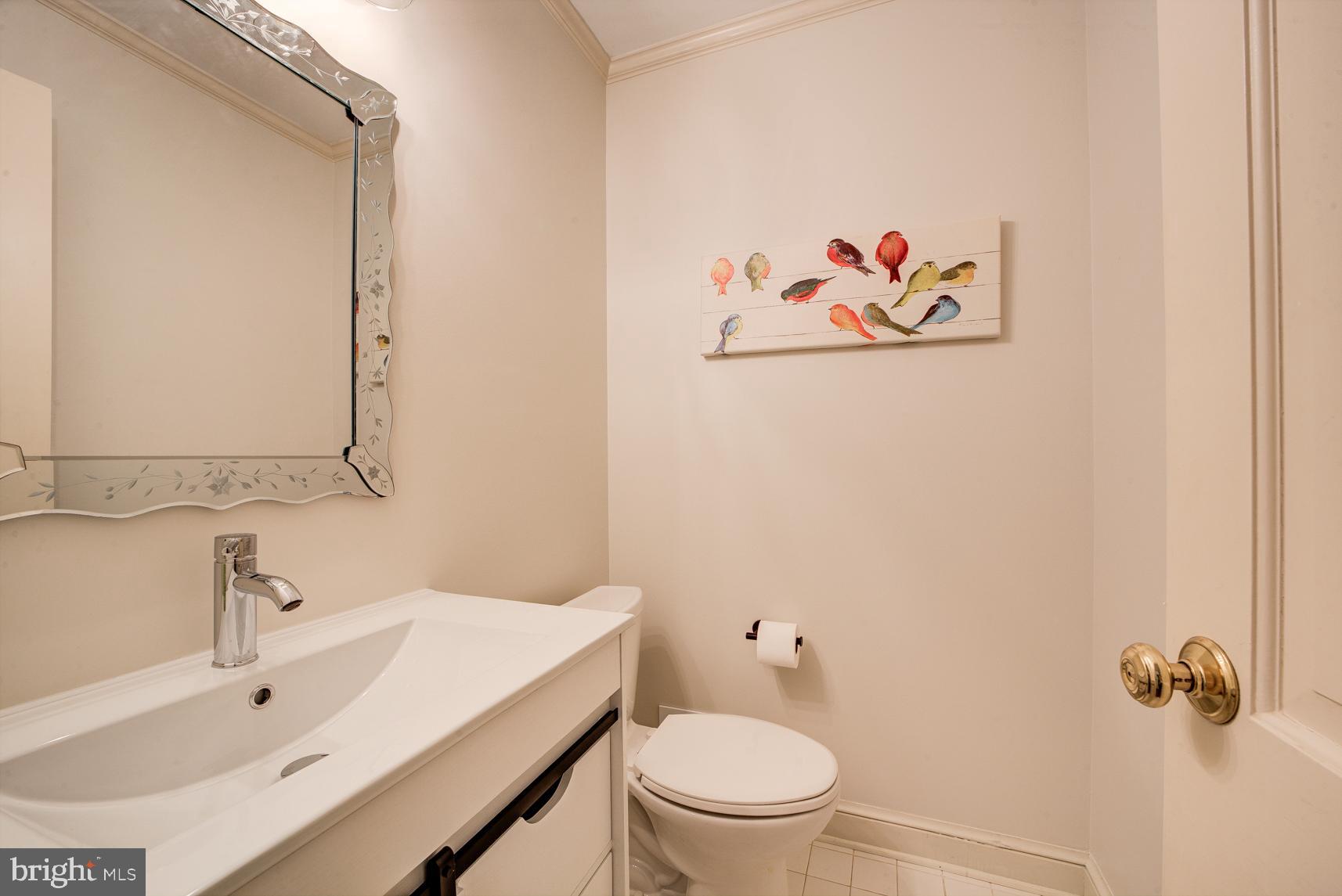 9116 Wooden Bridge Road Potomac, MD 20854 - Photo 8 of 22 a bathroom with a sink and a toilet