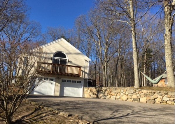 35 Downey Street Hopkinton, MA 01748 - Photo 1 of 28 a front view of a house with a yard