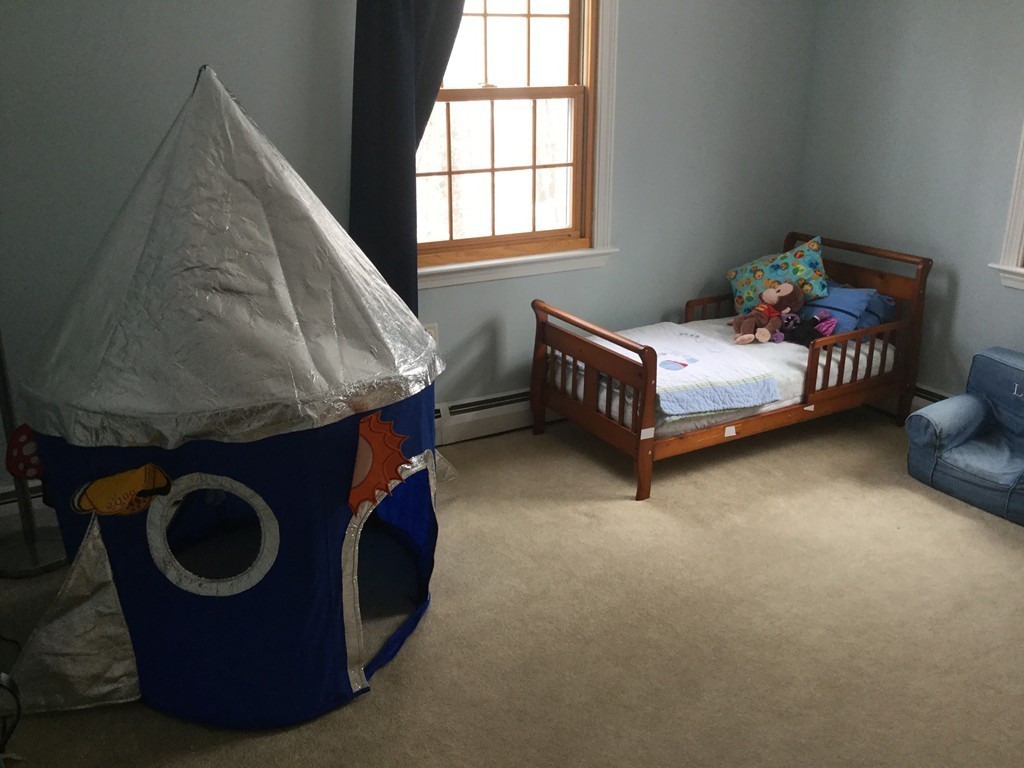 35 Downey Street Hopkinton, MA 01748 - Photo 12 of 28 a bedroom with a bed and window