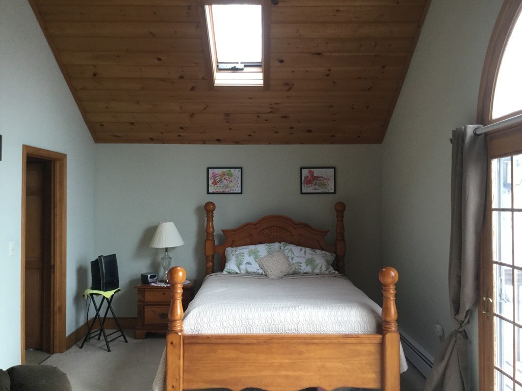 35 Downey Street Hopkinton, MA 01748 - Photo 17 of 28 a bedroom with a bed and a window