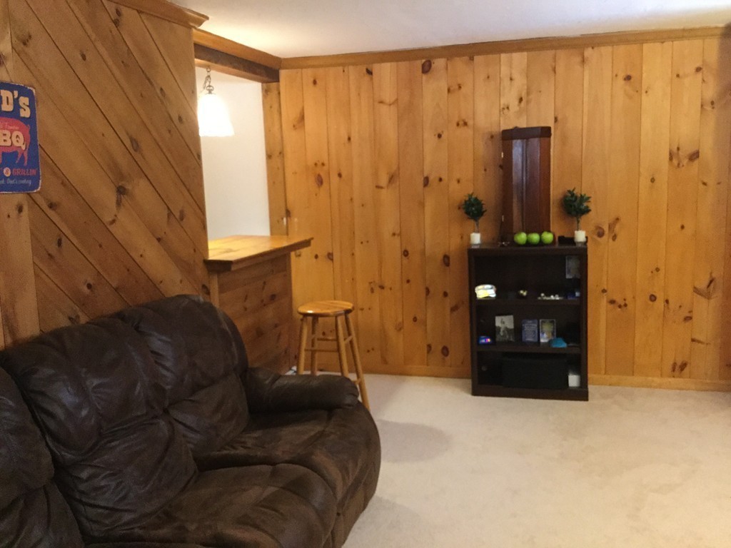 35 Downey Street Hopkinton, MA 01748 - Photo 22 of 28 a living room with furniture and a closet