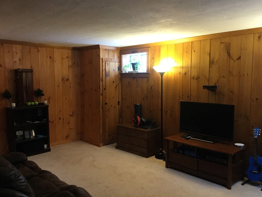 35 Downey Street Hopkinton, MA 01748 - Photo 23 of 28 a bedroom with a bed and a television