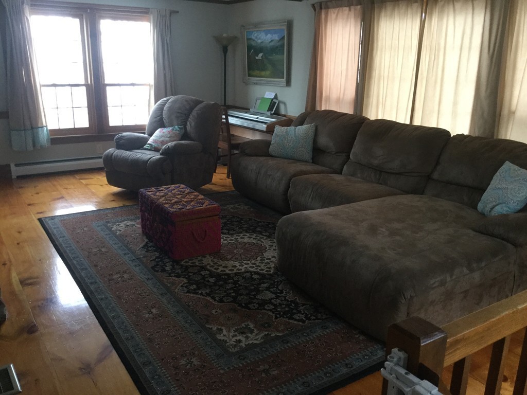 35 Downey Street Hopkinton, MA 01748 - Photo 7 of 28 a living room with furniture and a large window