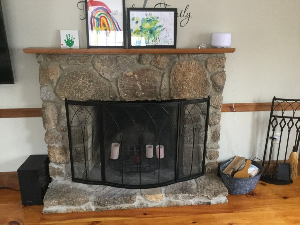 35 Downey Street Hopkinton, MA 01748 - Photo 8 of 28 a living room with furniture and a fireplace