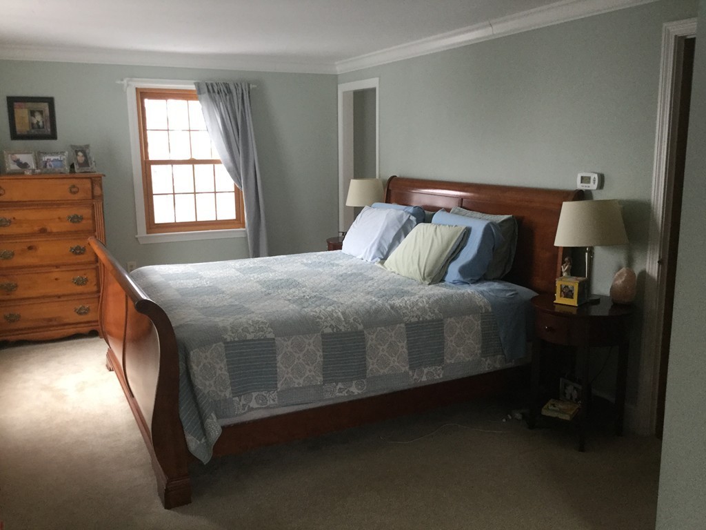 35 Downey Street Hopkinton, MA 01748 - Photo 9 of 28 a bedroom with a bed and window
