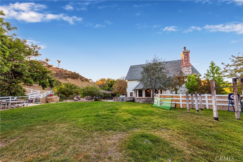85 Saddlebow Road Bell Canyon, CA 91307 - Photo 53 of 75 a view of a house with a big yard and large trees