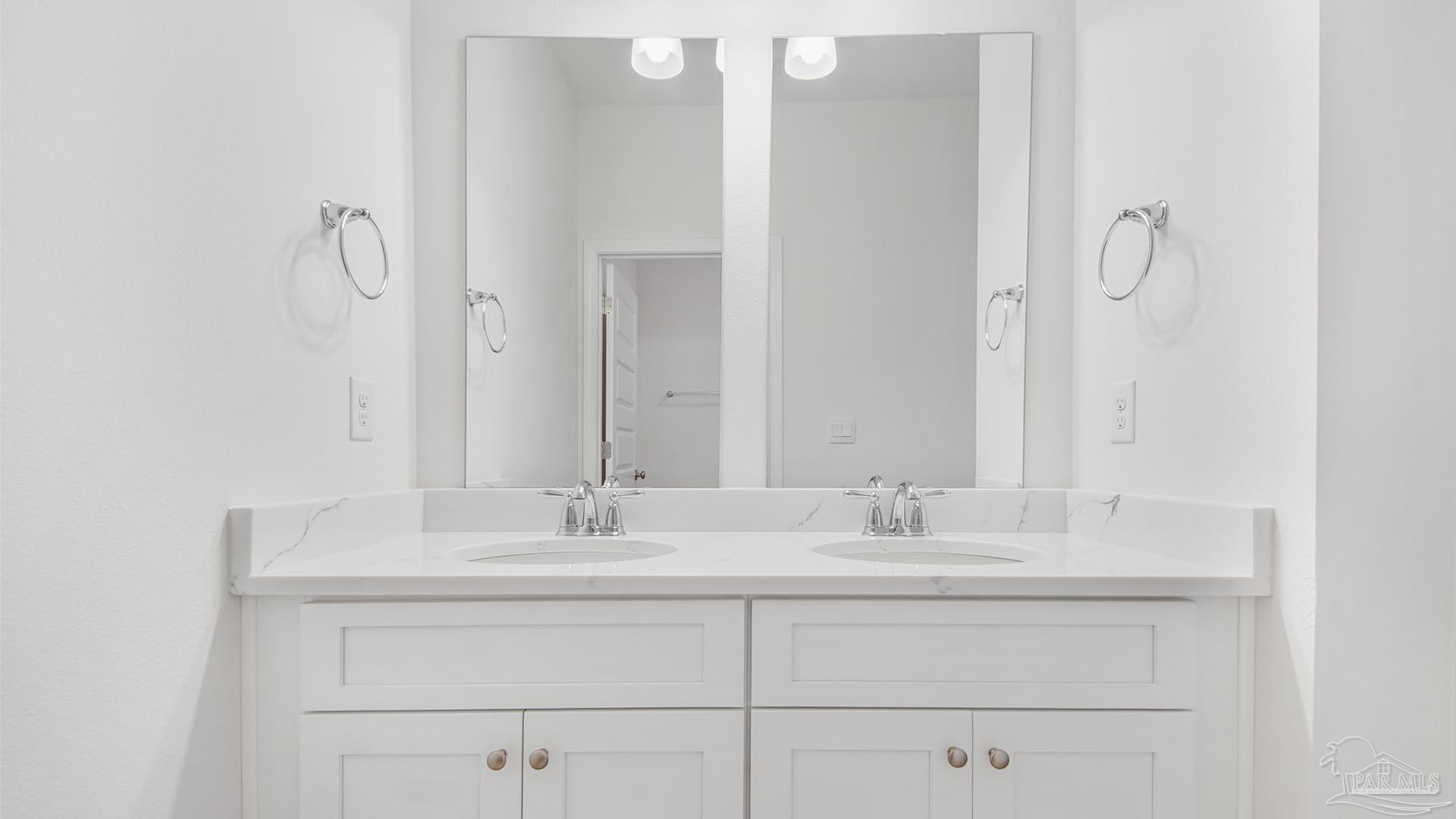 3233 Harrier Road Pace, FL 32571 - Photo 24 of 50 a bathroom with a sink vanity and a mirror