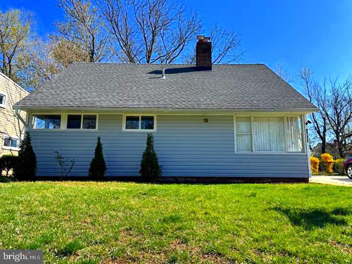 9711 Dilston Road Silver Spring, MD 20903 - Photo 2 of 44 a view of a house with a yard