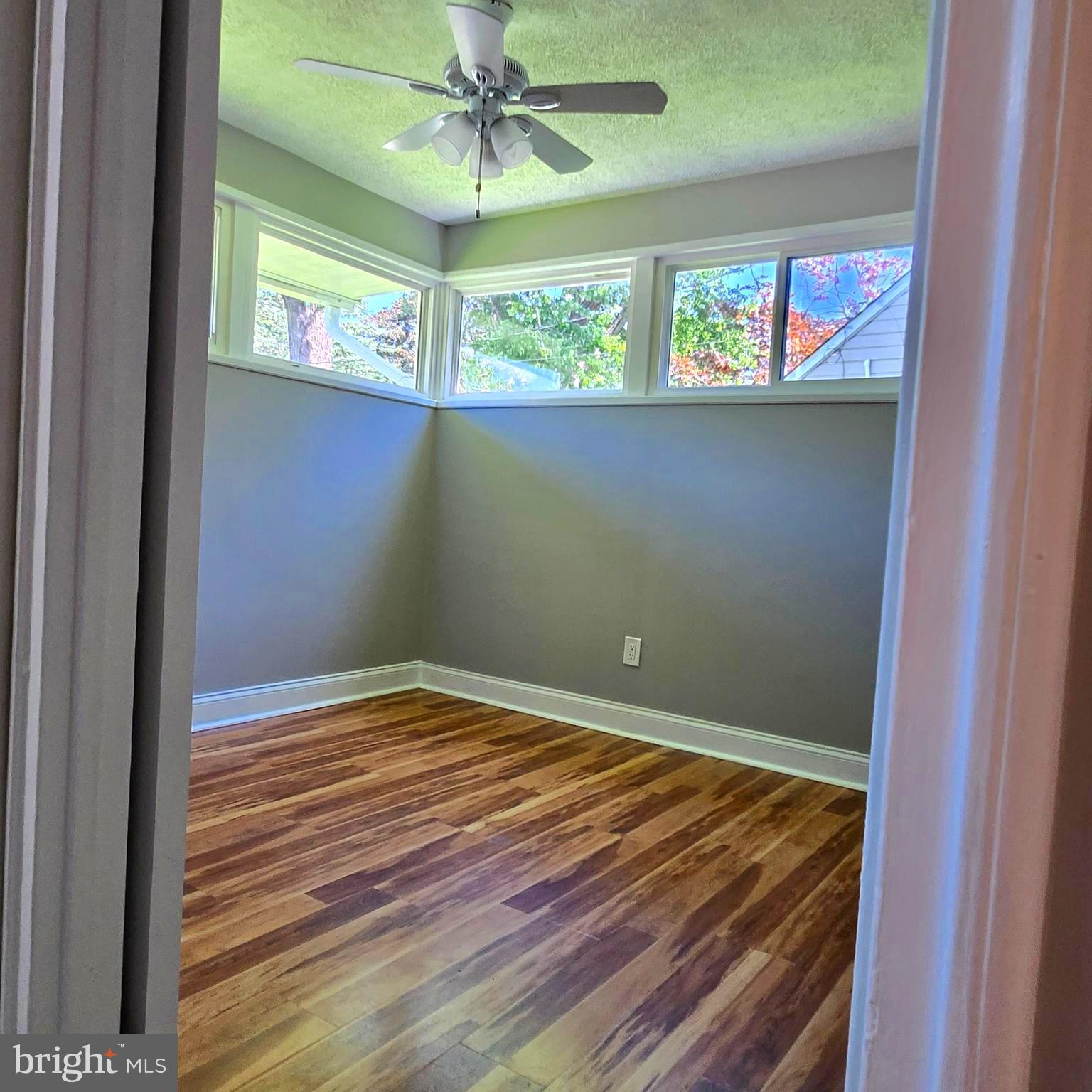 9711 Dilston Road Silver Spring, MD 20903 - Photo 29 of 44 a view of room with window and ceiling fan