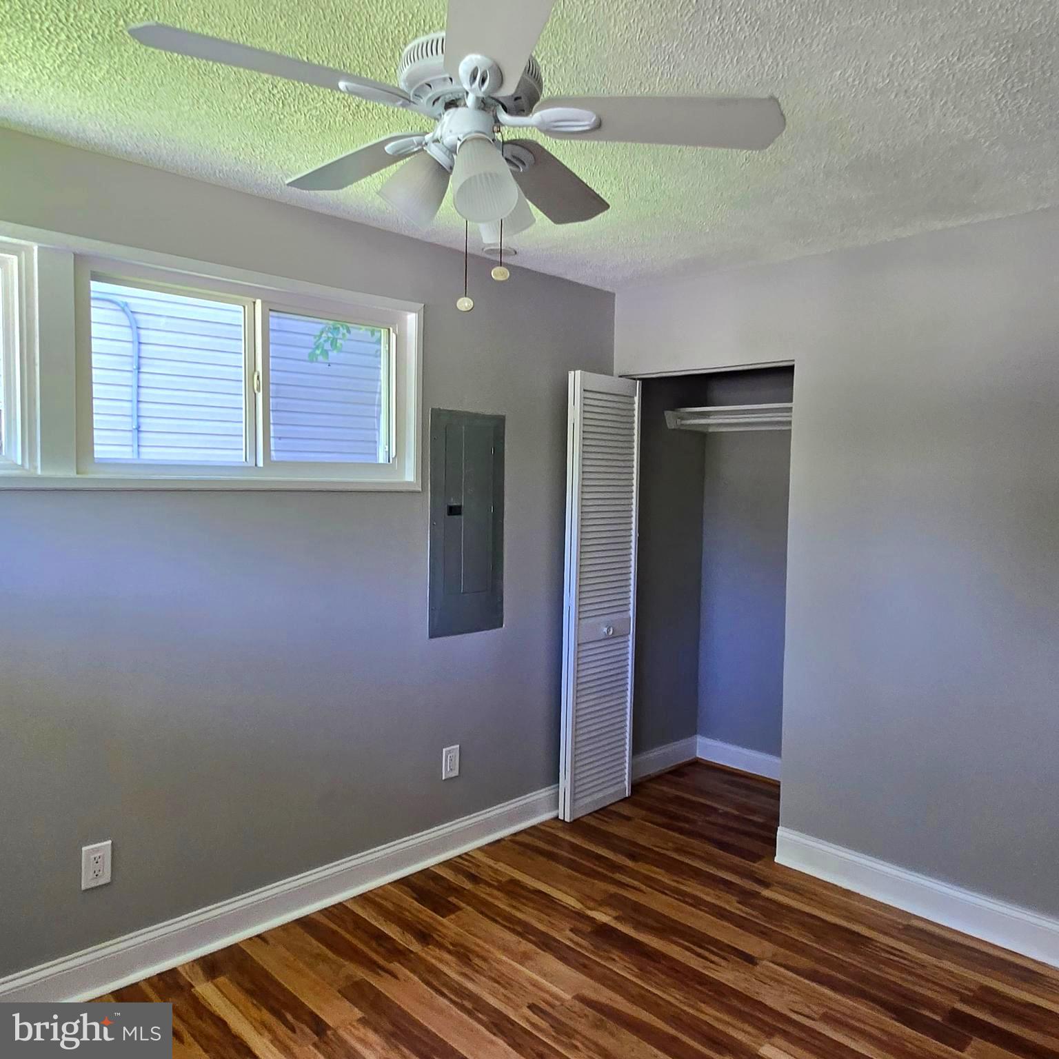 9711 Dilston Road Silver Spring, MD 20903 - Photo 30 of 44 a view of an empty room with window and chandelier fan