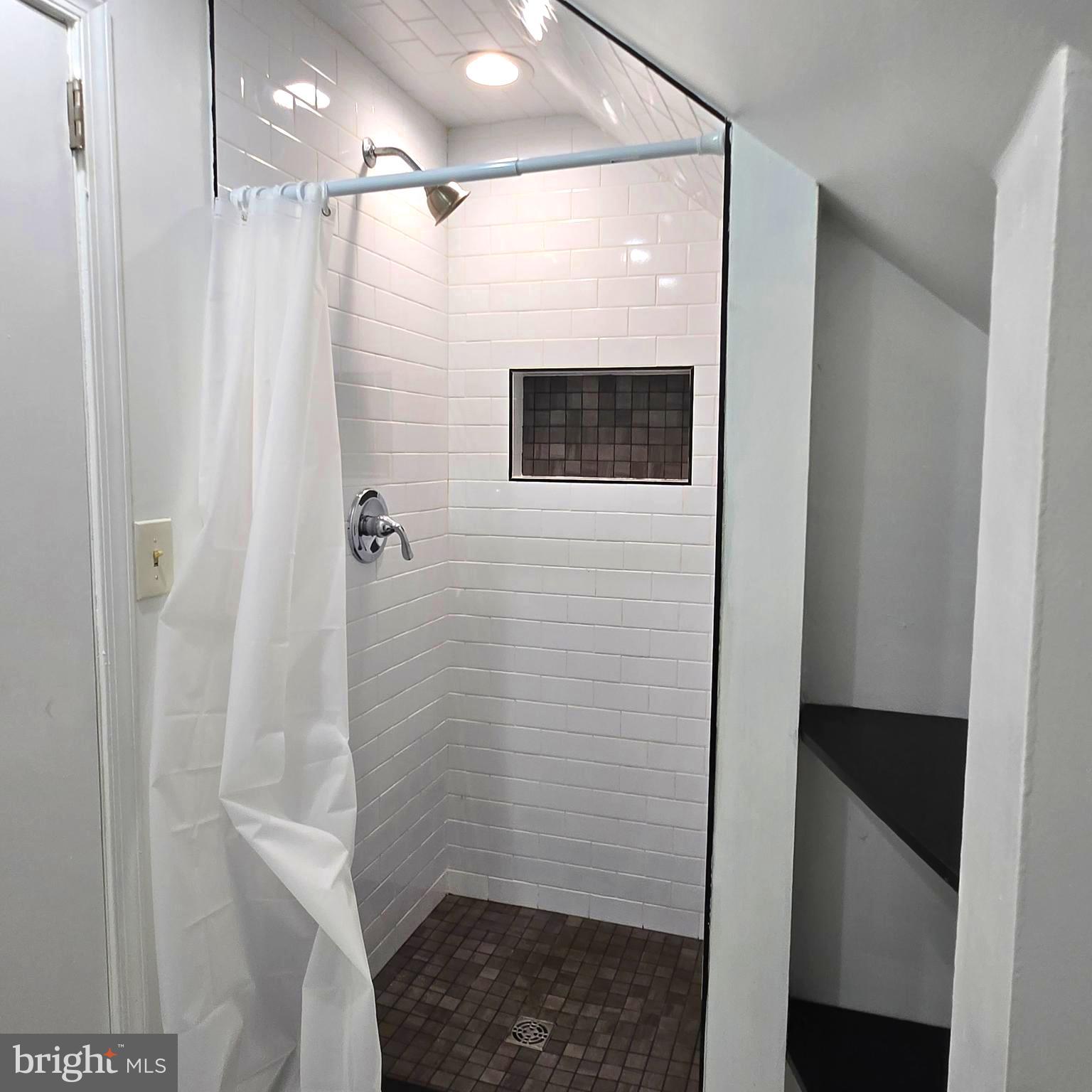 9711 Dilston Road Silver Spring, MD 20903 - Photo 36 of 44 a bathroom with a shower and a sink