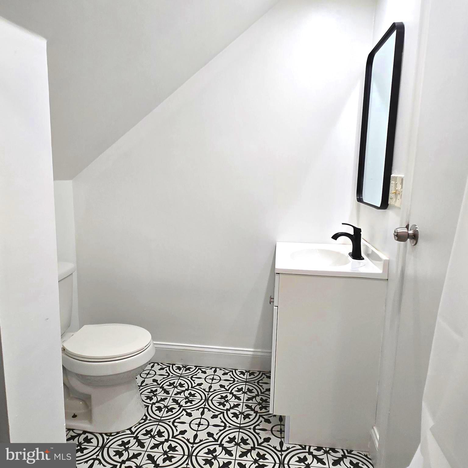 9711 Dilston Road Silver Spring, MD 20903 - Photo 37 of 44 a bathroom with a sink and a toilet