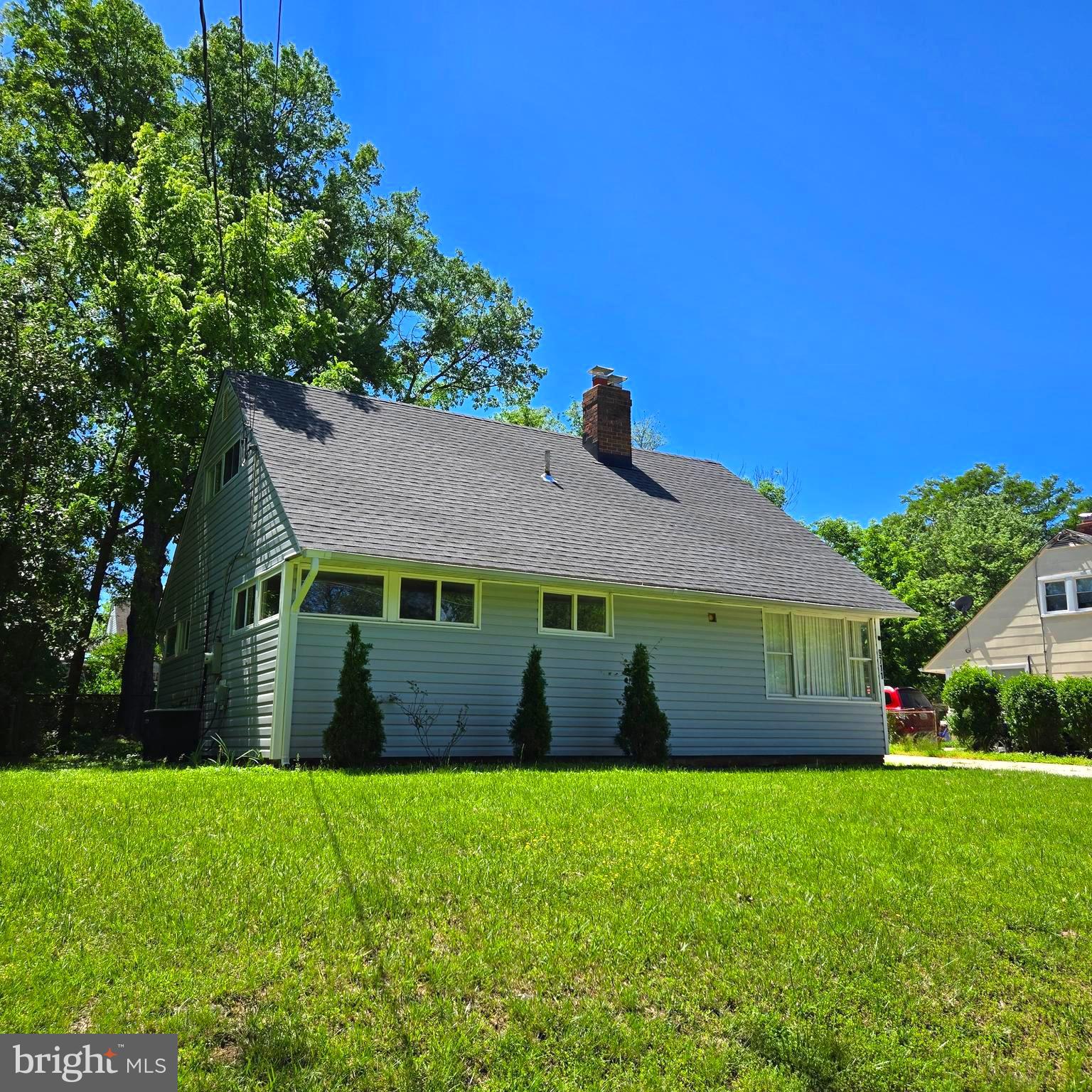 9711 Dilston Road Silver Spring, MD 20903 - Photo 5 of 44 a front view of a house with a garden