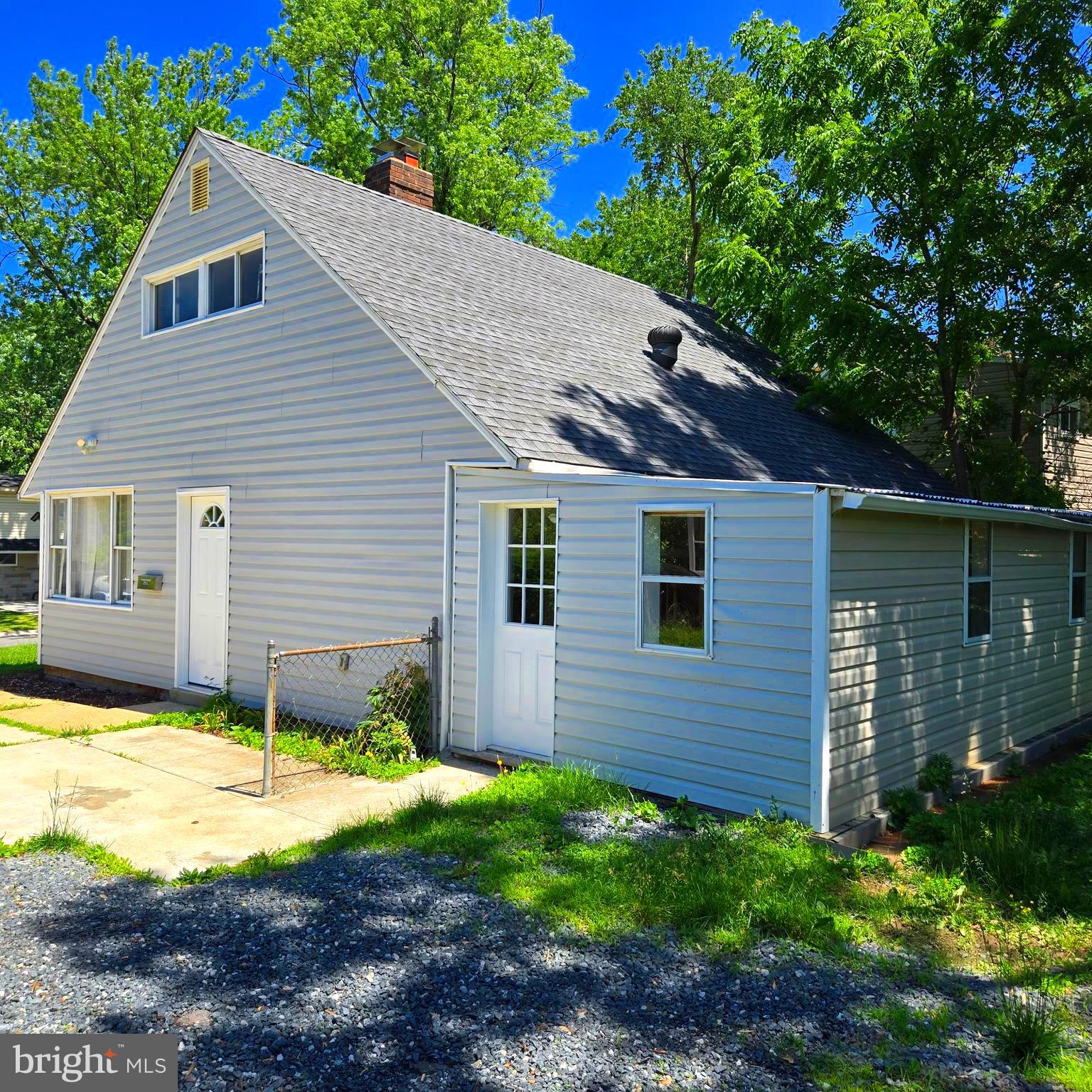 9711 Dilston Road Silver Spring, MD 20903 - Photo 6 of 44 a view of a house with a yard