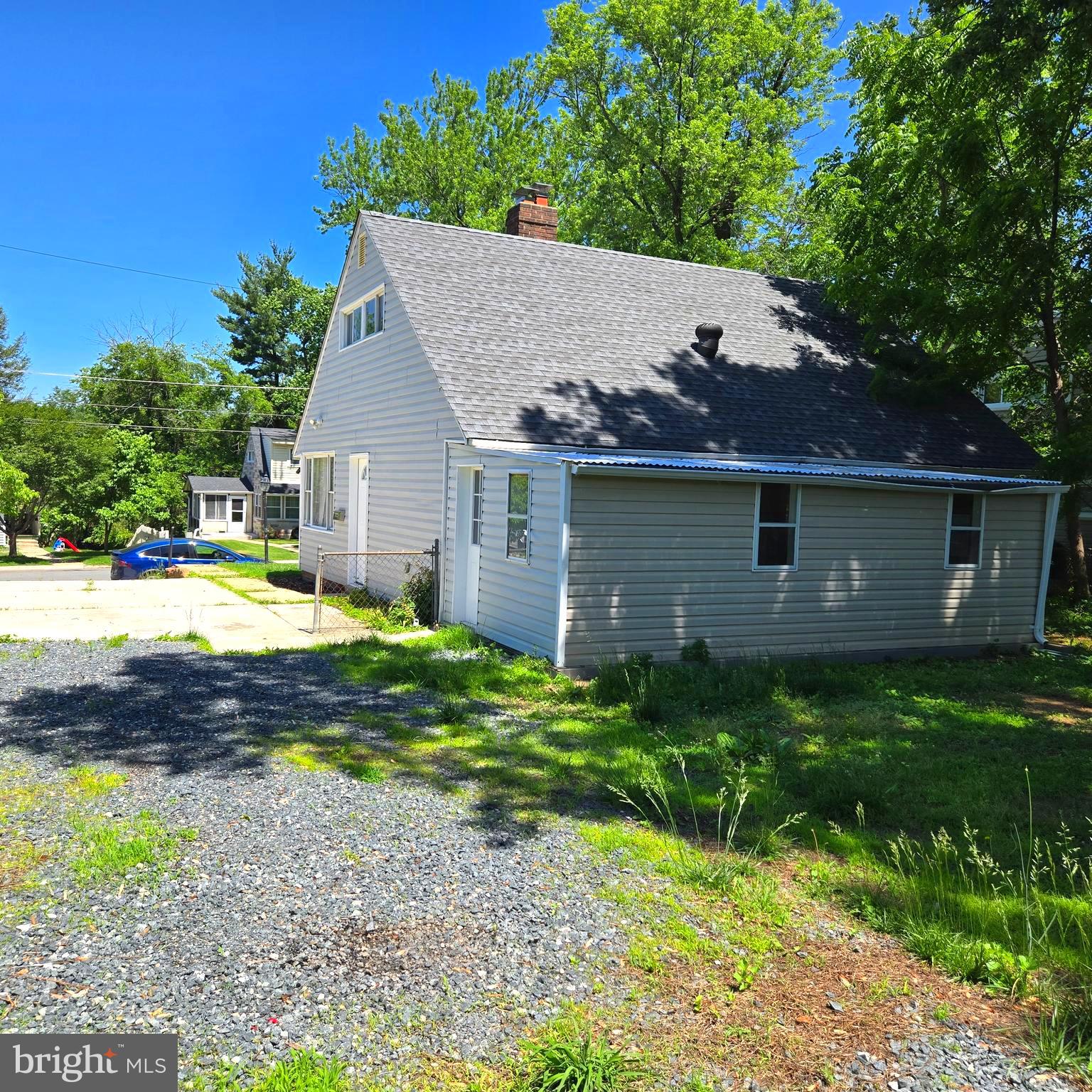 9711 Dilston Road Silver Spring, MD 20903 - Photo 8 of 44 a view of house with yard and outdoor seating