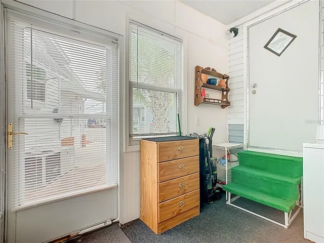 a room with a dresser and a window