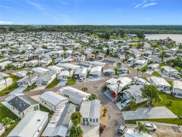 a aerial view of a dining tables and chairs in the ocean