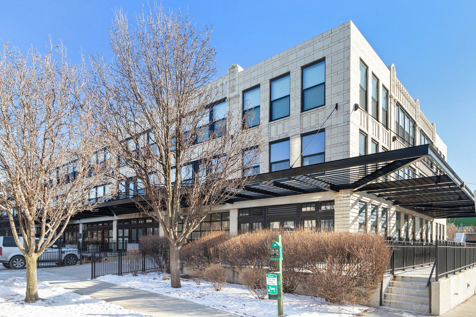 a large building with a tree in front of it