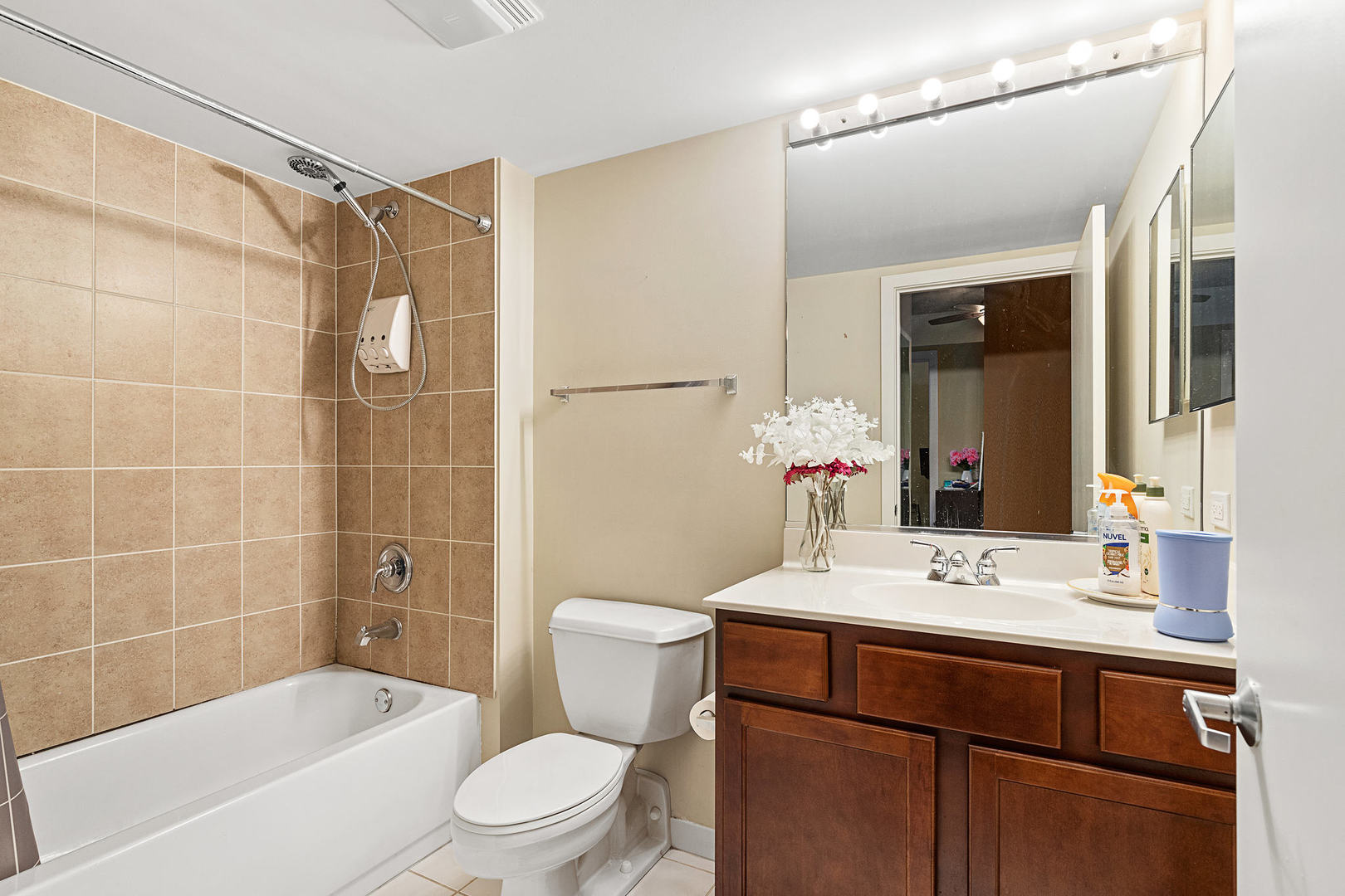 1111 West 15th Street, Unit 235 Chicago, IL 60608 - Photo 17 of 21 a bathroom with a sink mirror toilet and bathtub
