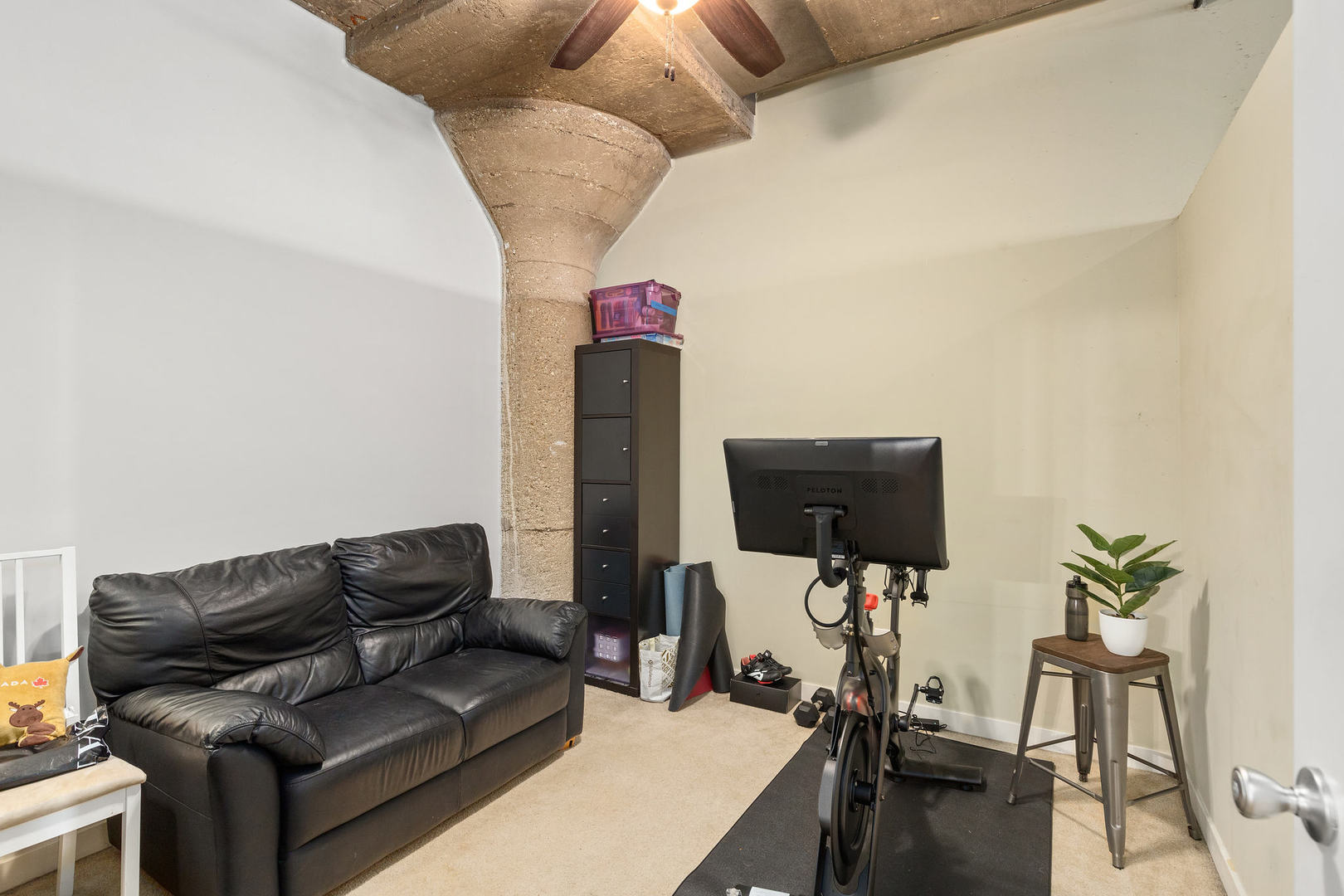 1111 West 15th Street, Unit 235 Chicago, IL 60608 - Photo 19 of 21 a living room with furniture and a flat screen tv