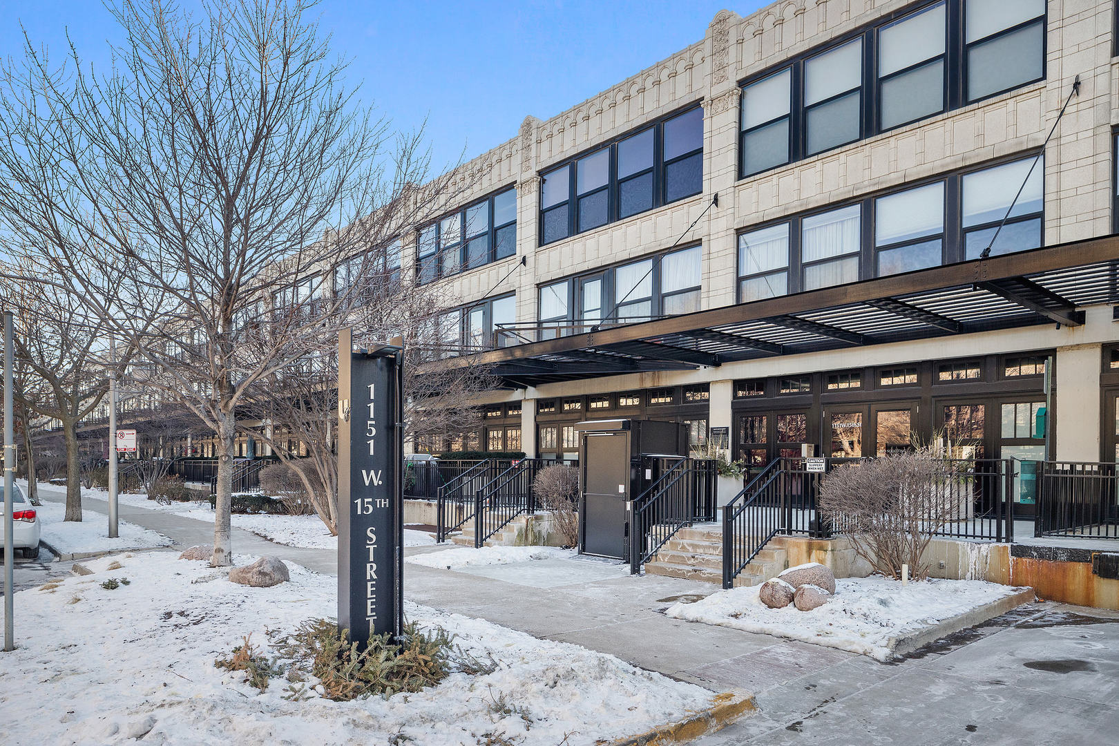 1111 West 15th Street, Unit 235 Chicago, IL 60608 - Photo 2 of 21 a view of a building with a patio