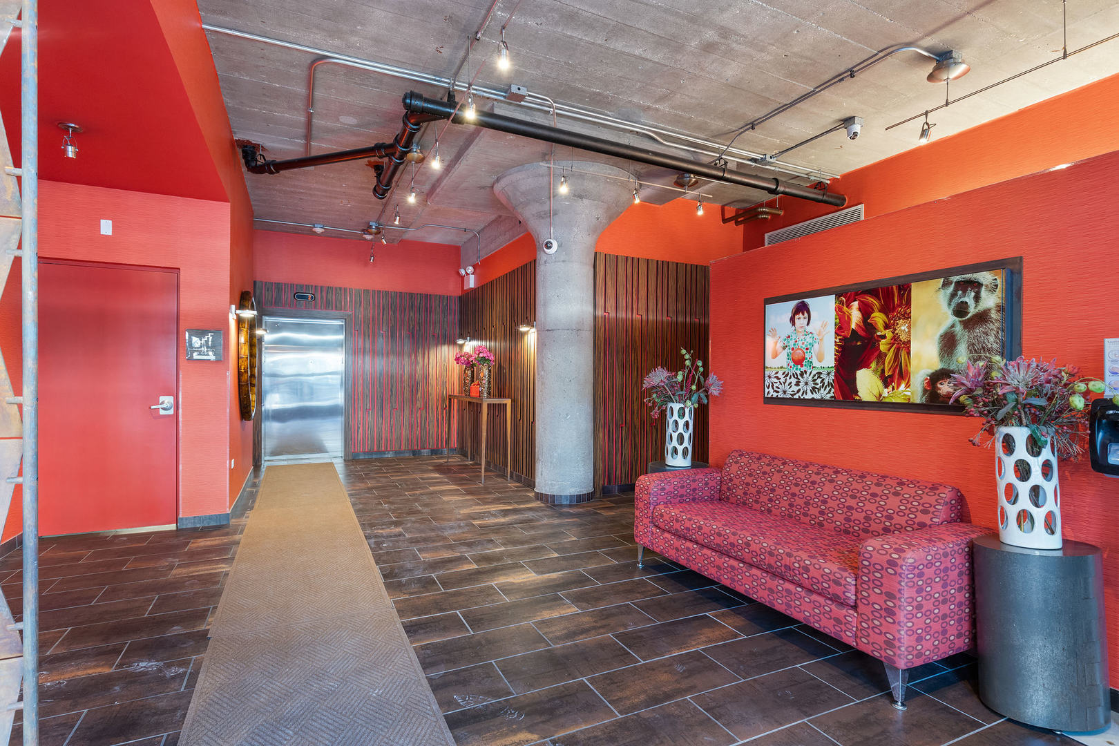 1111 West 15th Street, Unit 235 Chicago, IL 60608 - Photo 3 of 21 a lobby with furniture and window