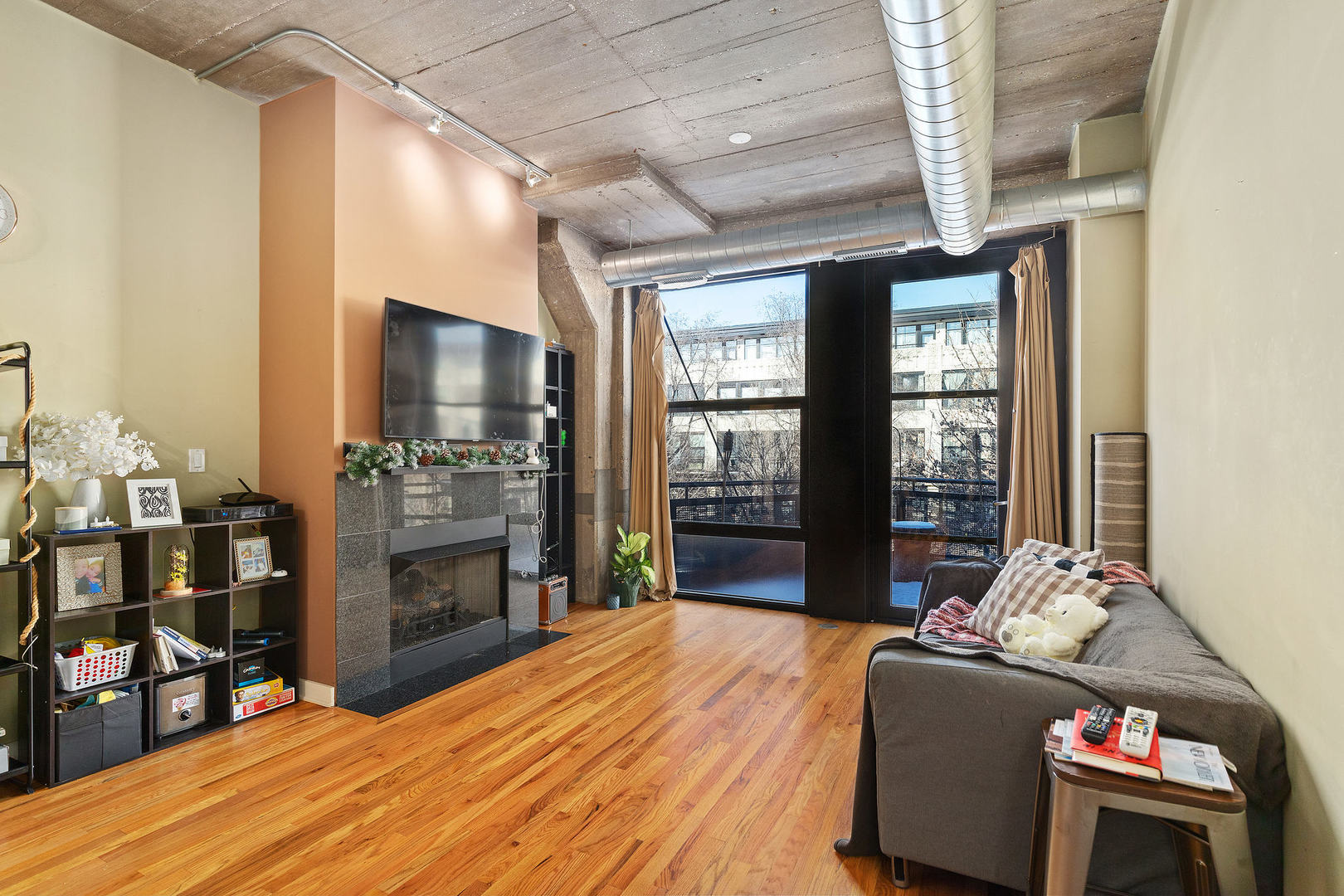 1111 West 15th Street, Unit 235 Chicago, IL 60608 - Photo 6 of 21 a bed room with a bed and a television