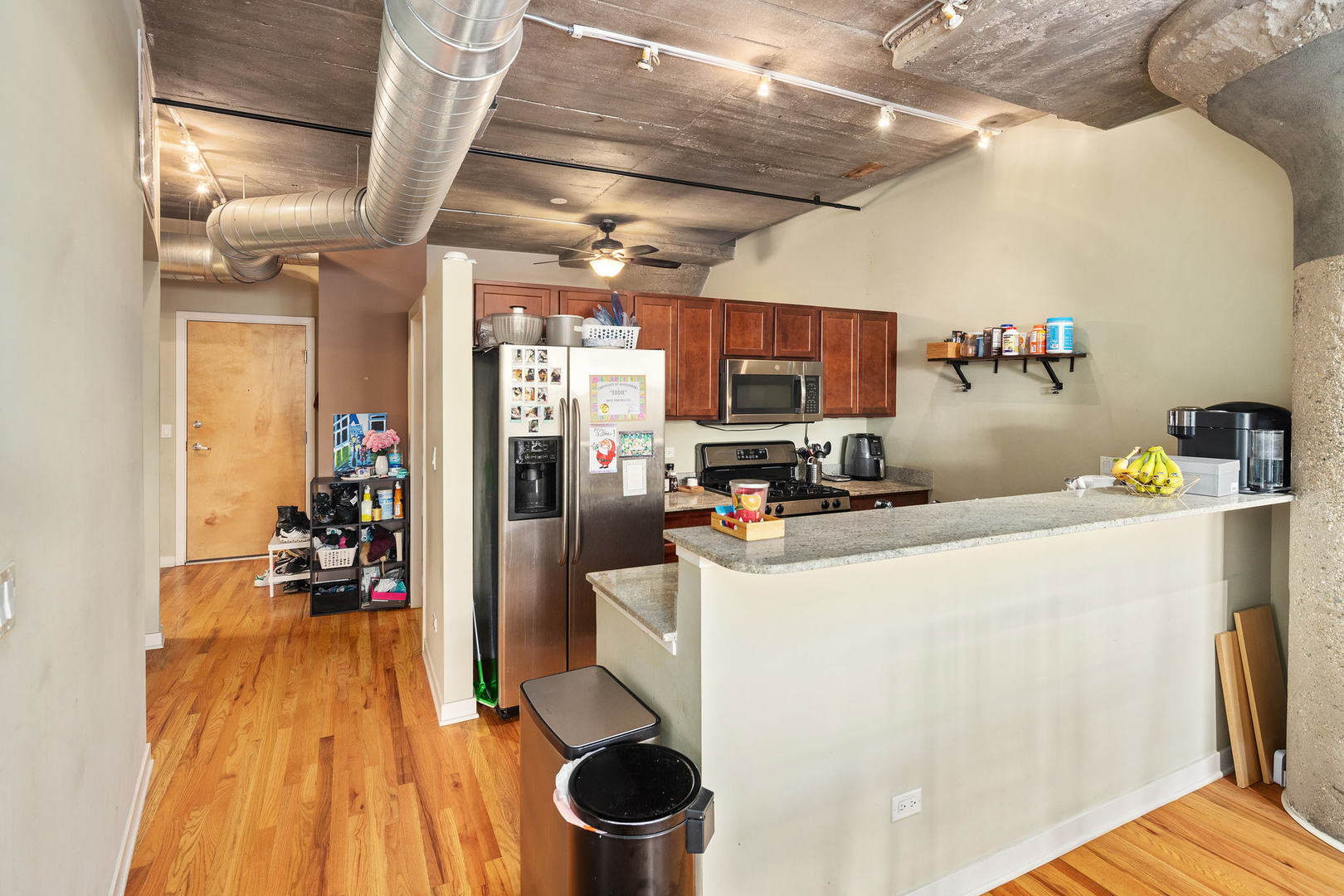 1111 West 15th Street, Unit 235 Chicago, IL 60608 - Photo 9 of 21 a kitchen with a refrigerator and a stove top oven