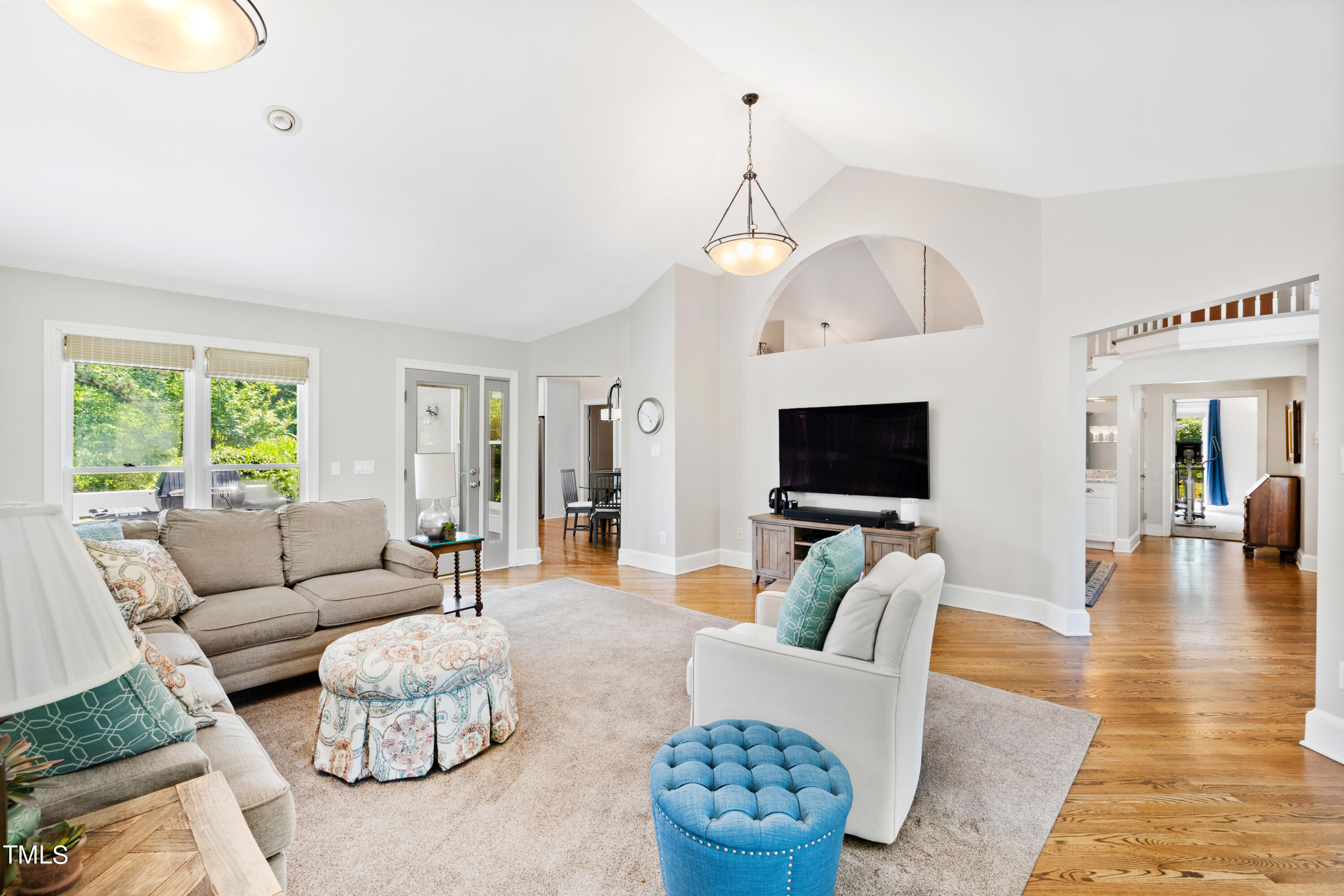 1605 Quaker Ridge Point Raleigh, NC 27615 - Photo 19 of 54 a living room with furniture or wooden floor and a flat screen tv