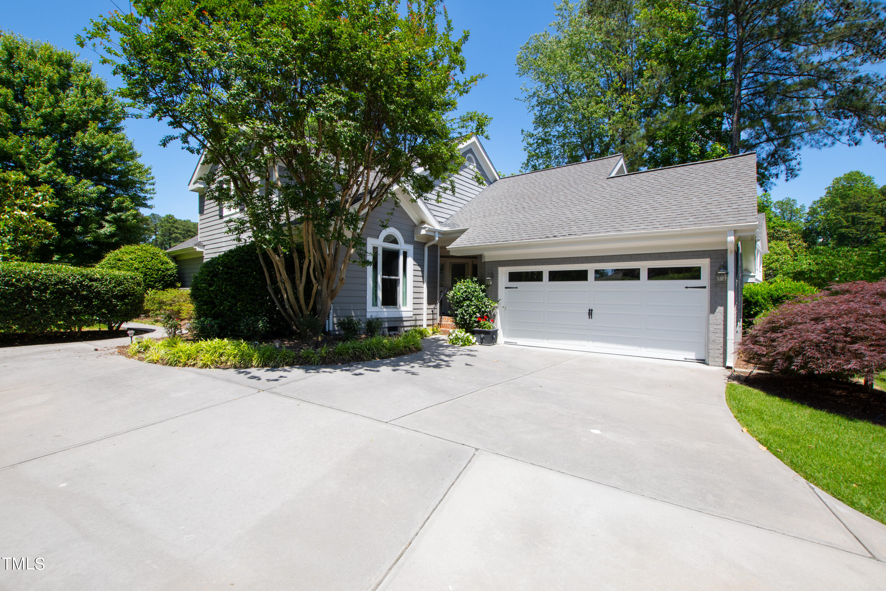 1605 Quaker Ridge Point Raleigh, NC 27615 - Photo 2 of 54 a front view of a house with a yard and garage