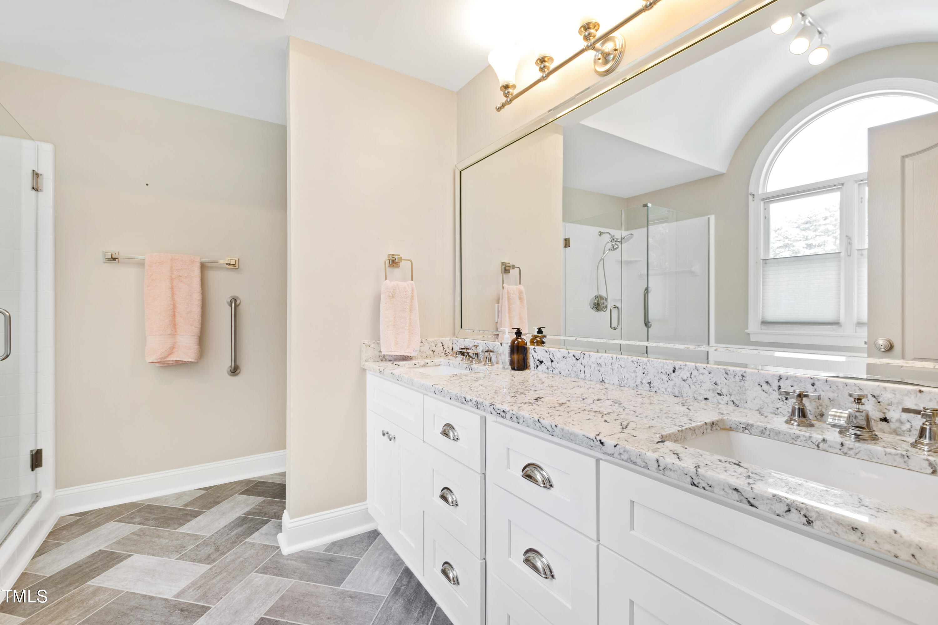 1605 Quaker Ridge Point Raleigh, NC 27615 - Photo 23 of 54 a bathroom with a granite countertop sink and a mirror