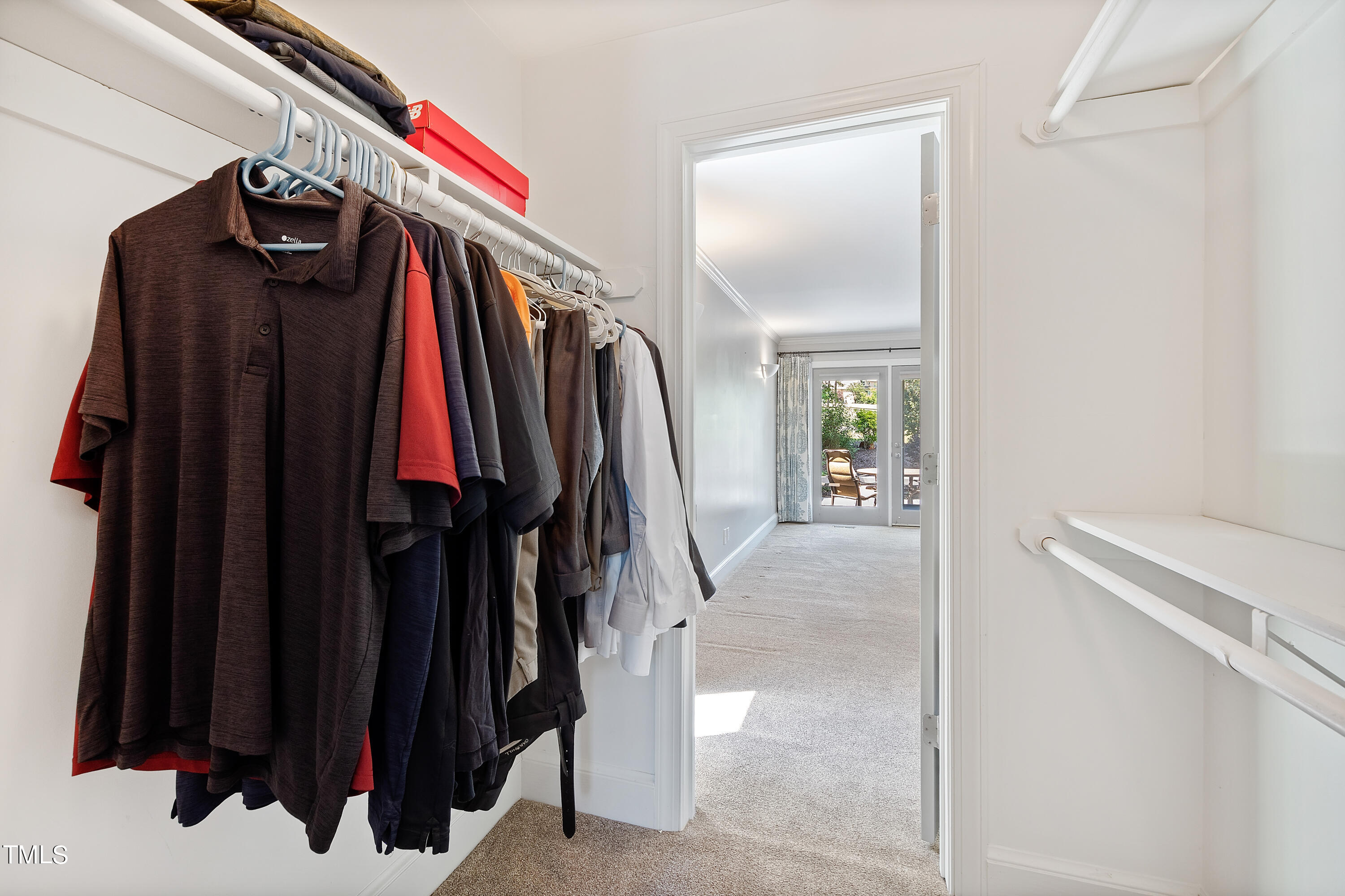 1605 Quaker Ridge Point Raleigh, NC 27615 - Photo 26 of 54 a view of walk in closet with clothes and shoes